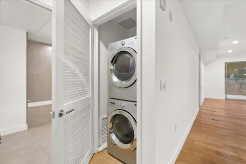a view of a hallway with washer and dryer