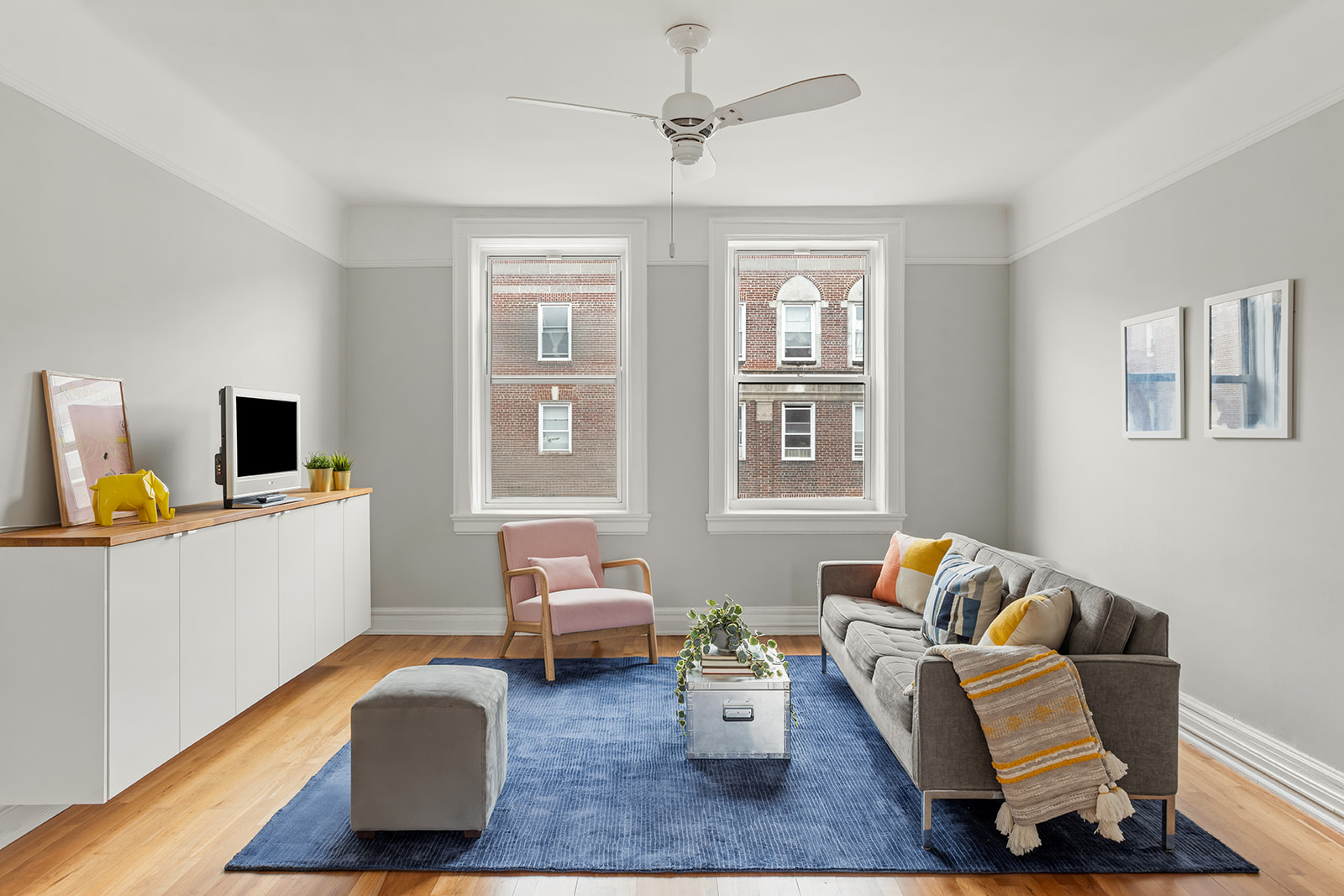34-43 82nd Street, Unit 51 Queens, NY 11372 - Photo 1 of 12 a living room with furniture and wooden floor