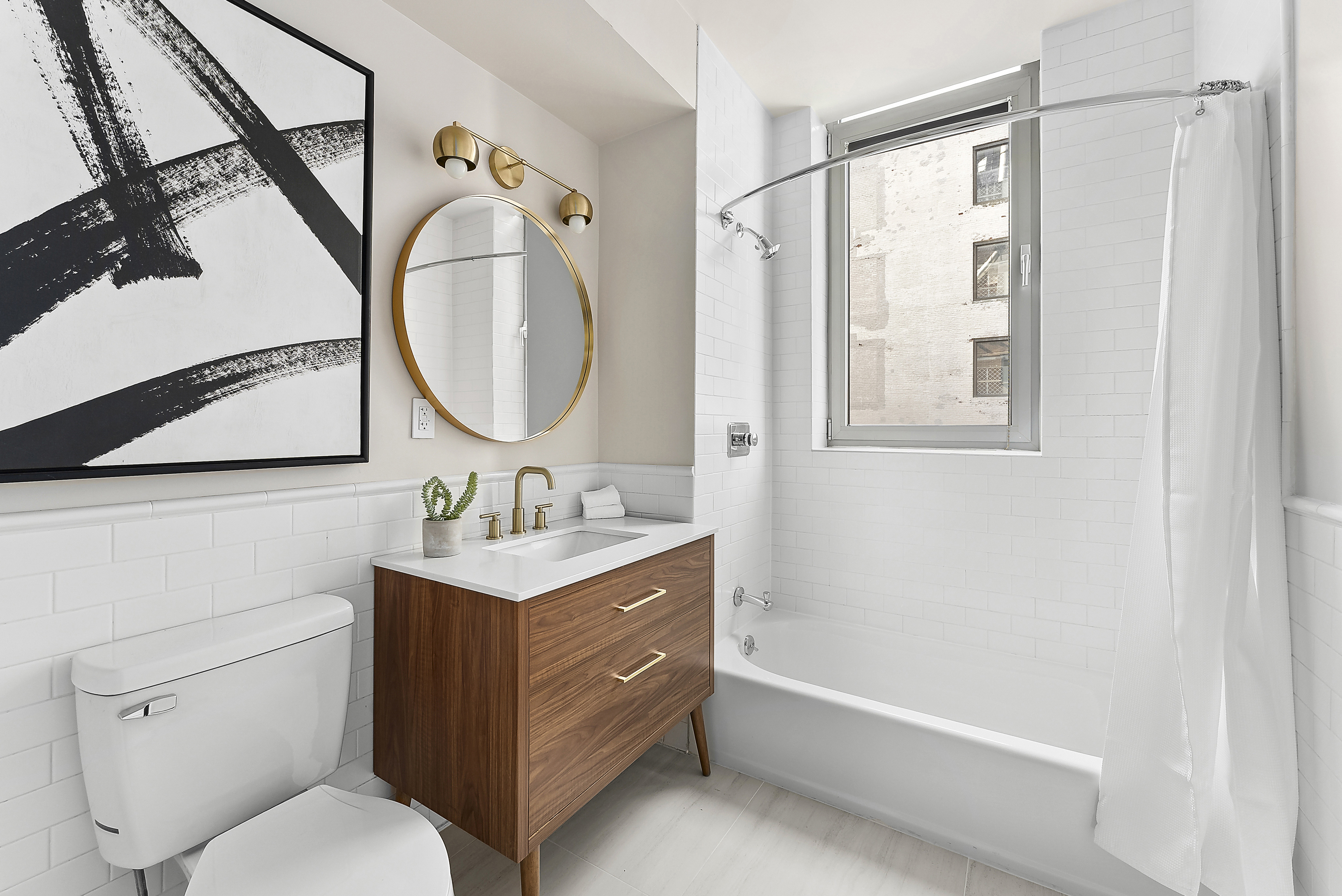 224 West 18th Street, Unit PHA Manhattan, NY 10011 - Photo 19 of 24 a bathroom with a toilet sink and mirror