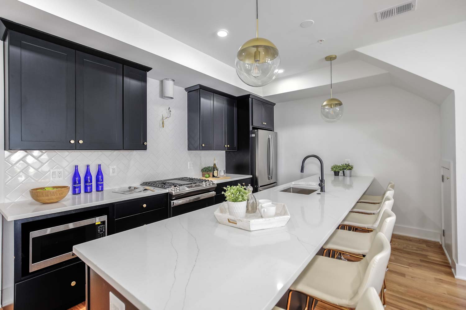 428 Manor Place Northwest, Unit 1 Washington, DC 20010 - Photo 6 of 27 a kitchen with granite countertop a sink cabinets and wooden floor