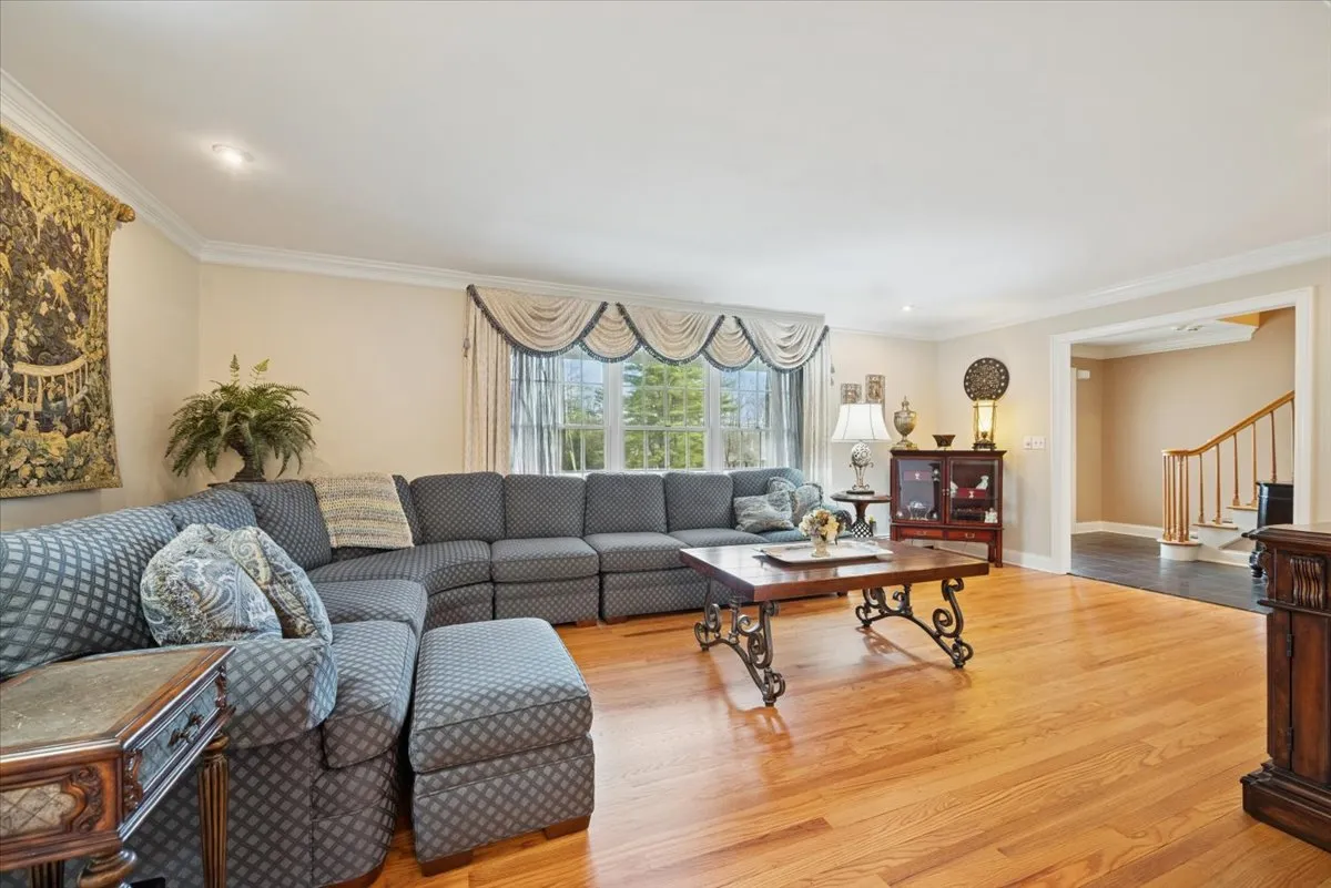 a open kitchen with sink a stove and wooden floors
