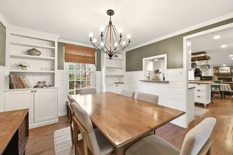 a dining room with furniture and window