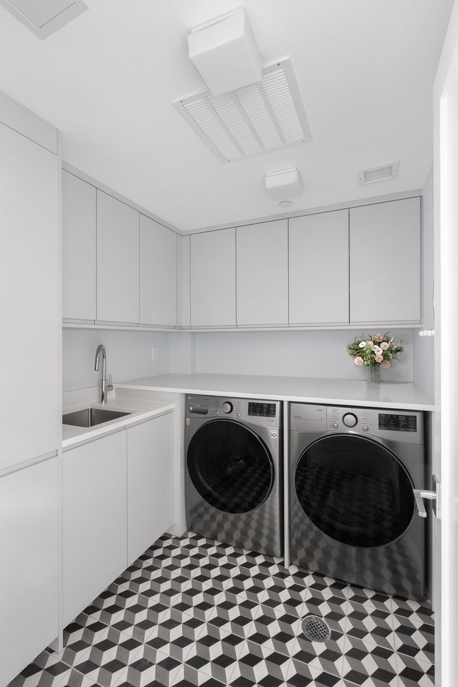 520 East 89th Street Manhattan, NY 10128 - Photo 28 of 40 a kitchen with stainless steel appliances a stove a sink and a cabinets