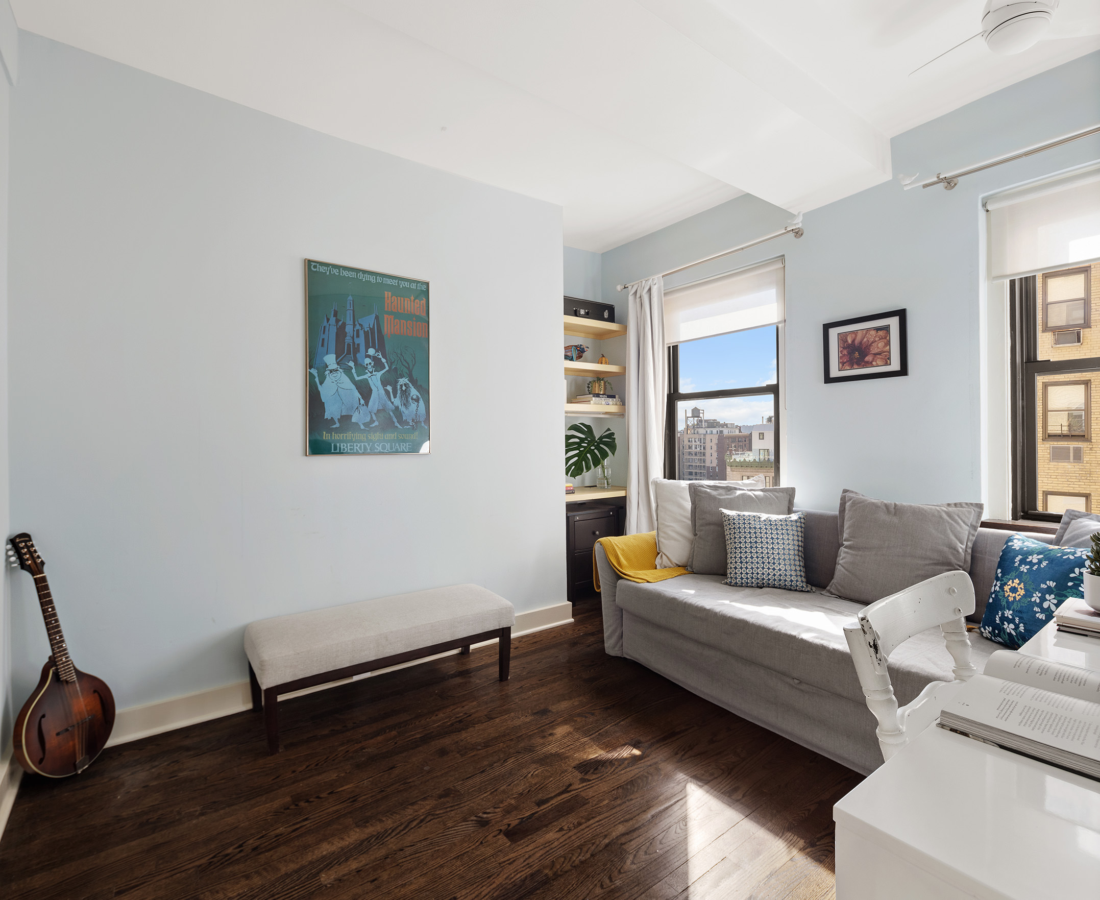 2166 Broadway, Unit 17C Manhattan, NY 10024 - Photo 8 of 11 a living room with furniture and a wooden floor