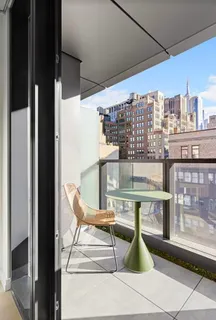 a view of a balcony with chairs