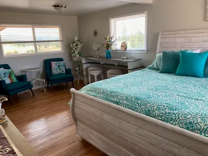 a roof deck with a table and chairs