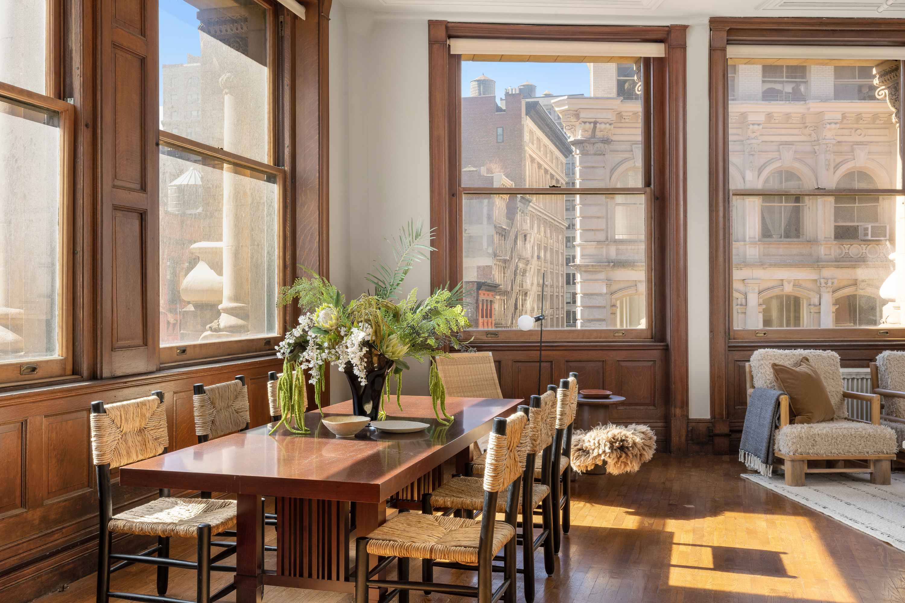874 Broadway, Unit 501 Manhattan, NY 10003 - Photo 4 of 17 a view of a dining room with furniture window and wooden floor