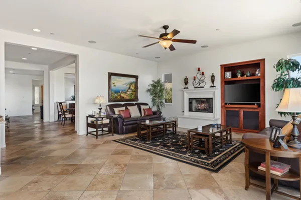 a spacious bedroom with a bed and a window