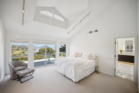 a bedroom with a bed and a couch