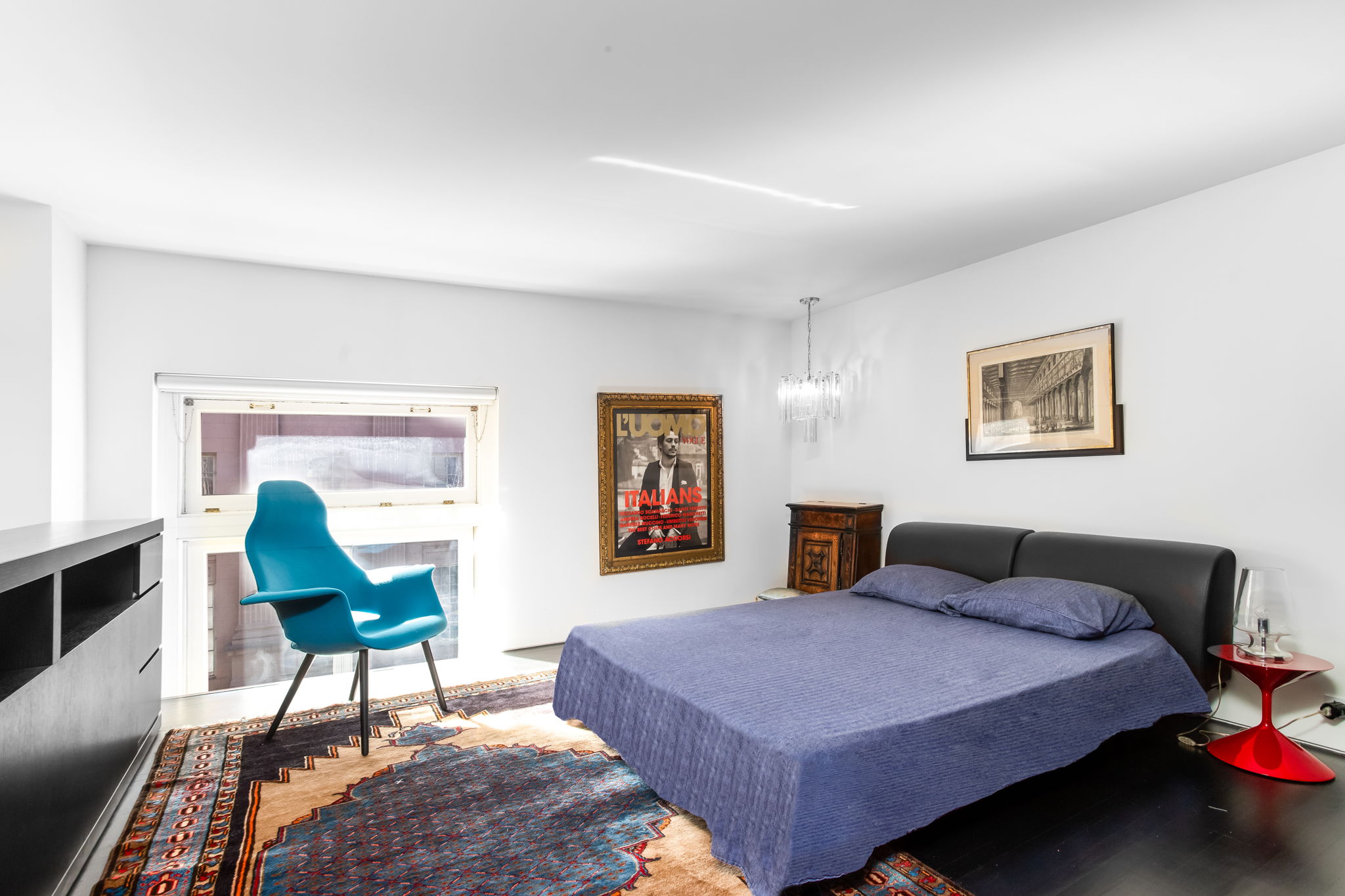 240 Centre Street, Unit 3H Manhattan, NY 10013 - Photo 7 of 20 a bedroom with a bed a table and chair