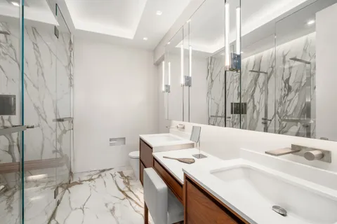 a bathroom with a bathtub and shower