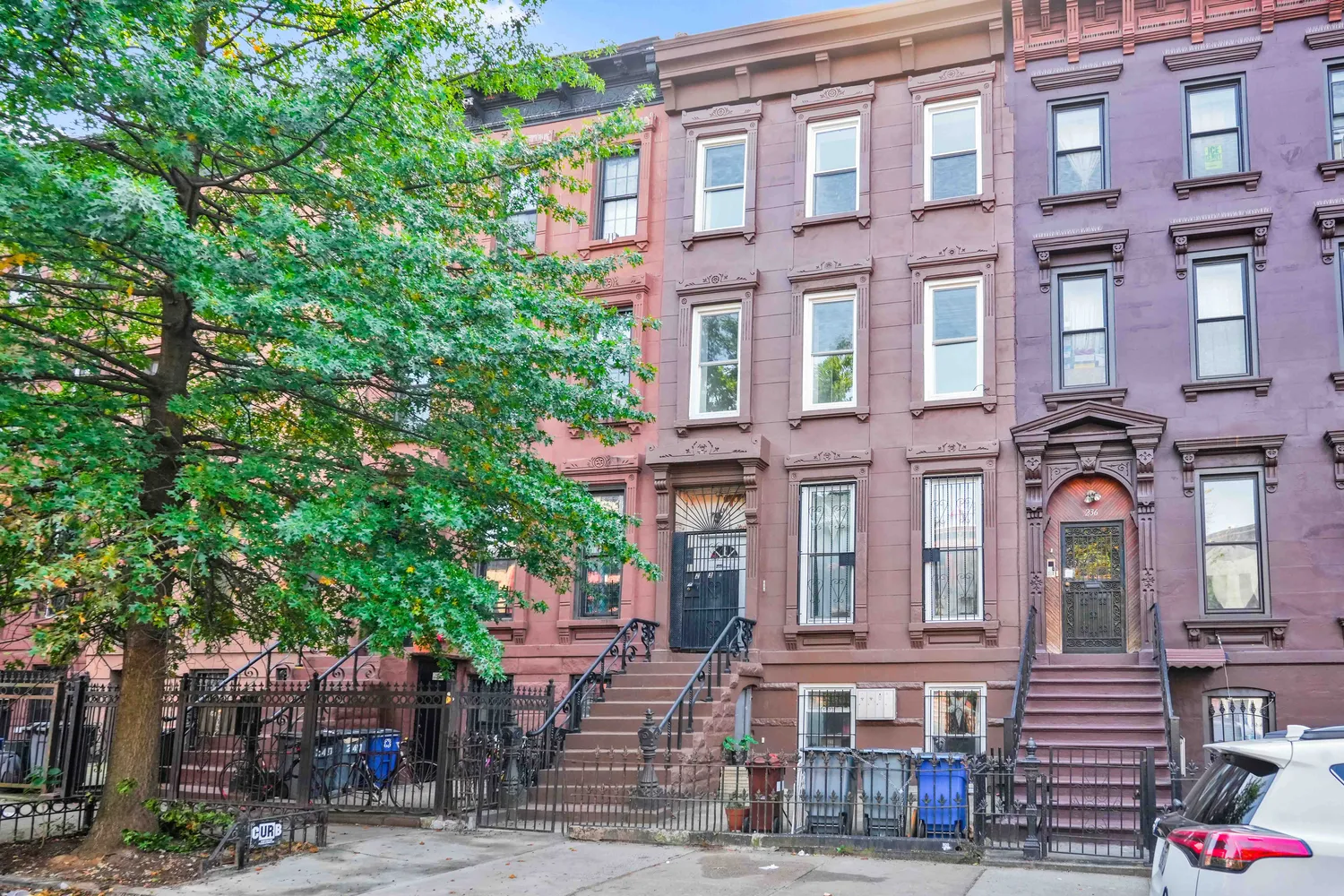 a front view of a building with street view