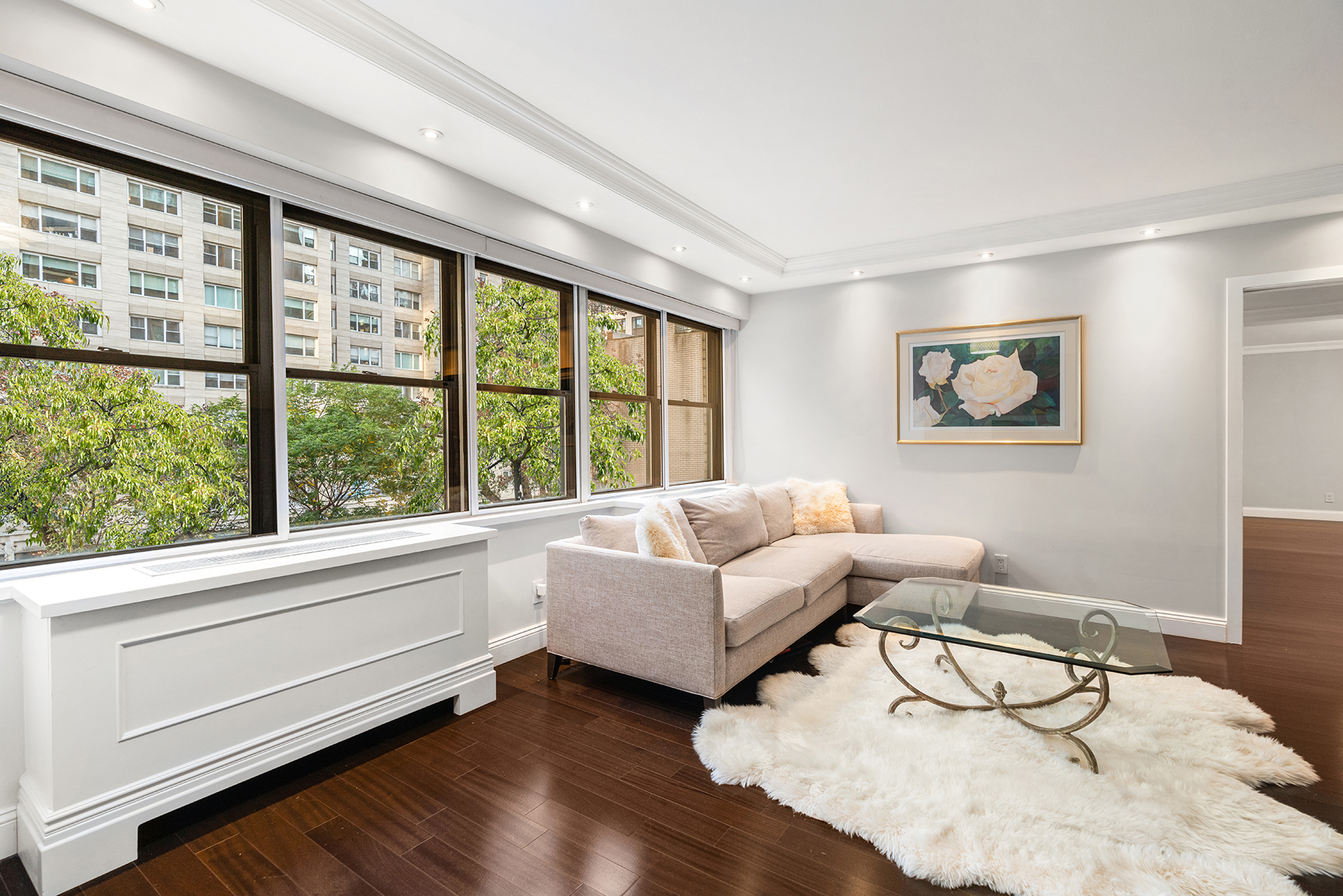 178 East 80th Street, Unit 3A Manhattan, NY 10075 - Photo 4 of 14 a living room with furniture and a large window