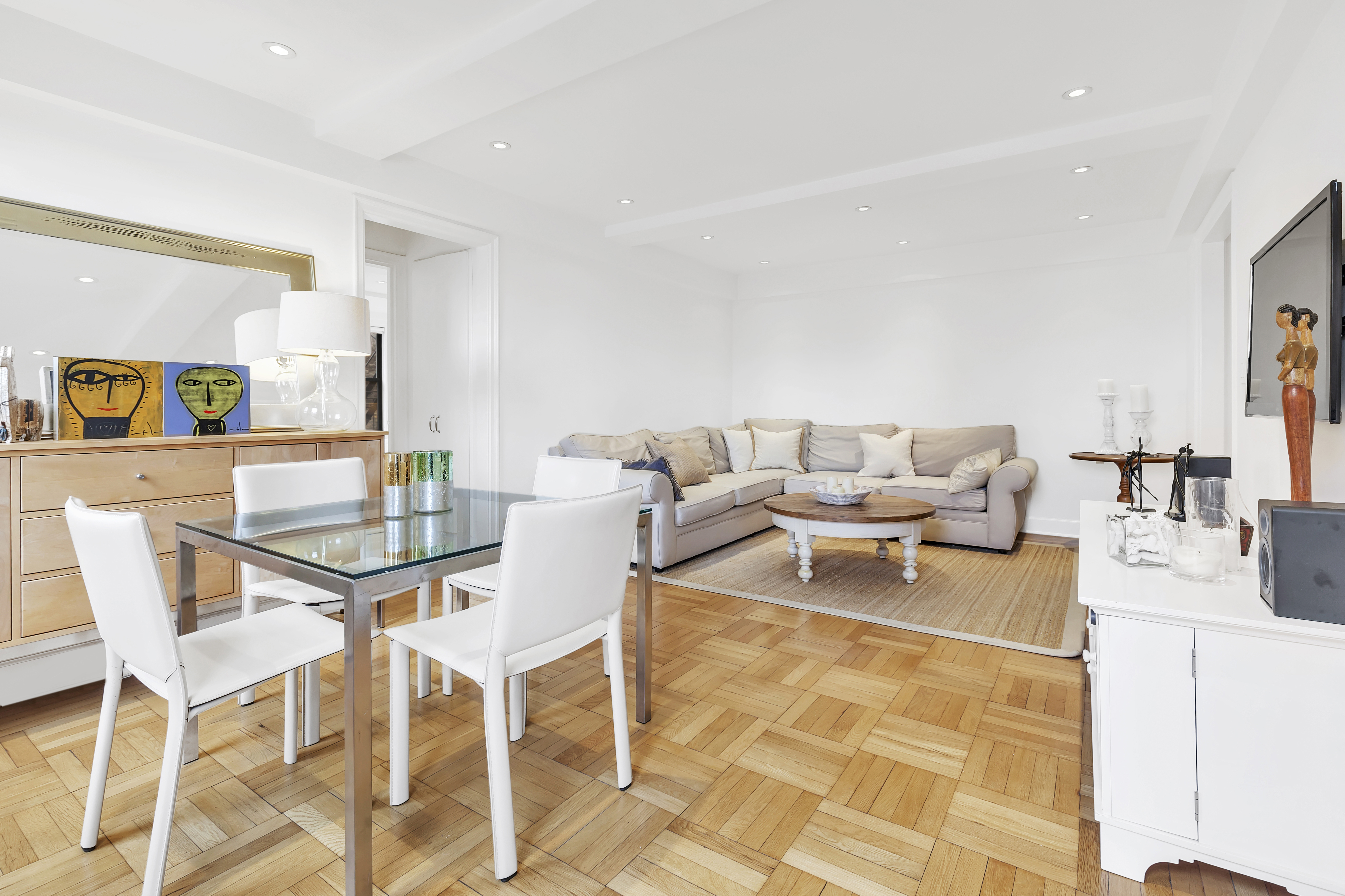 136 Waverly Place, Unit 6E Manhattan, NY 10014 - Photo 2 of 6 a view of a dining room with furniture and a rug
