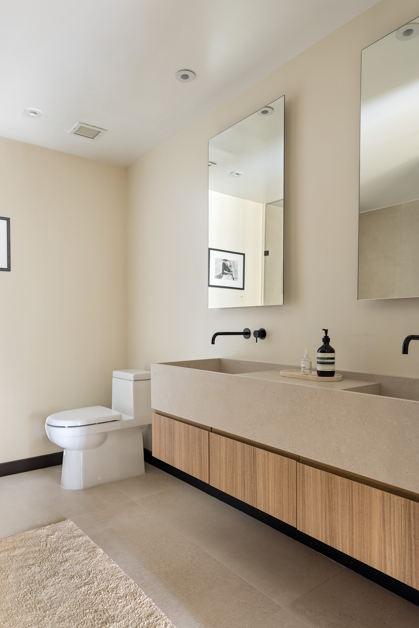 51 Jay Street, Unit 2A Brooklyn, NY 11201 - Photo 6 of 15 a bathroom with a toilet sink and mirror