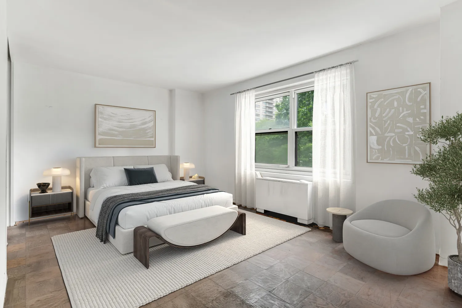 a spacious bedroom with a bed and a couch