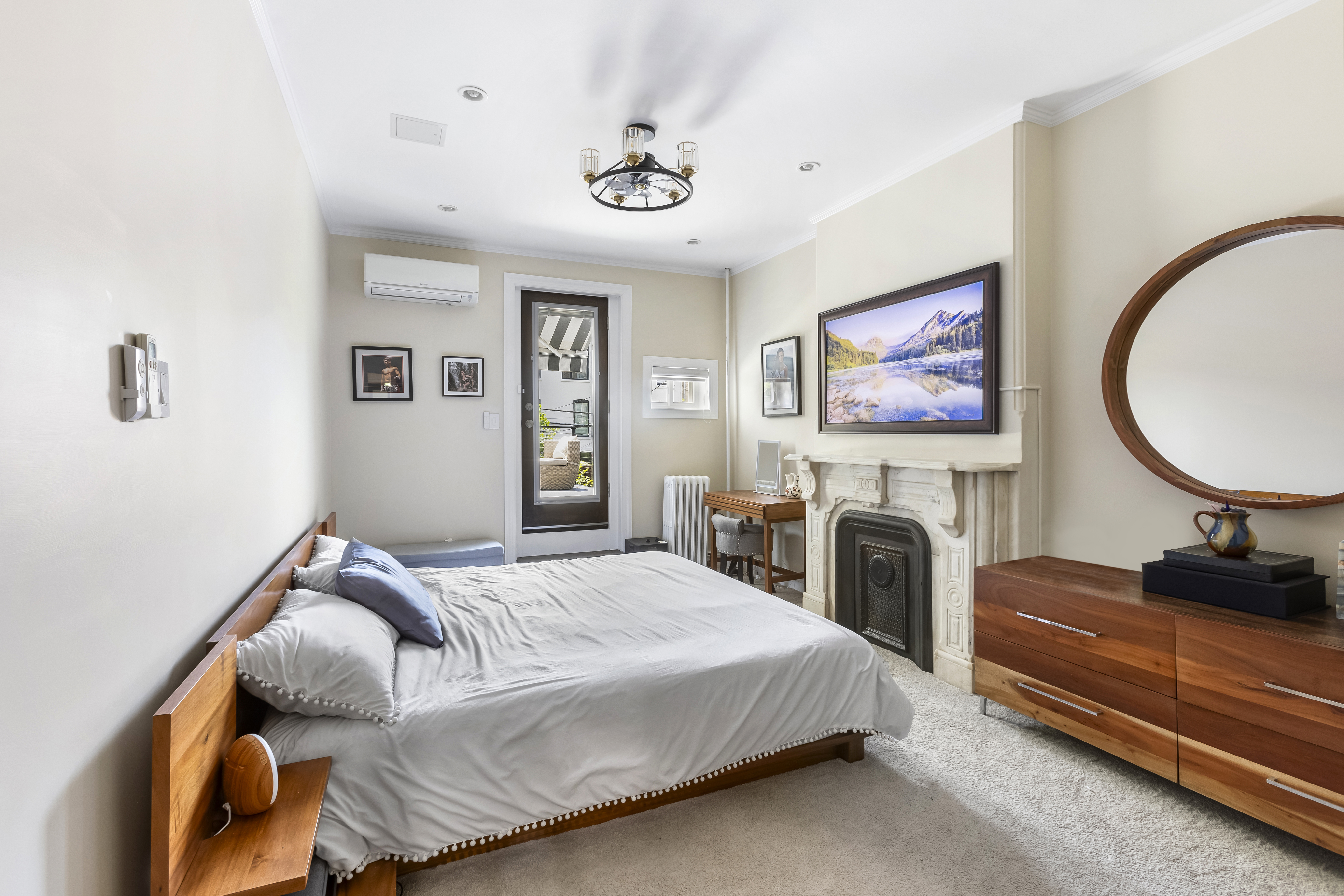 312 10th Street Brooklyn, NY 11215 - Photo 12 of 17 a bedroom with bed and a couch