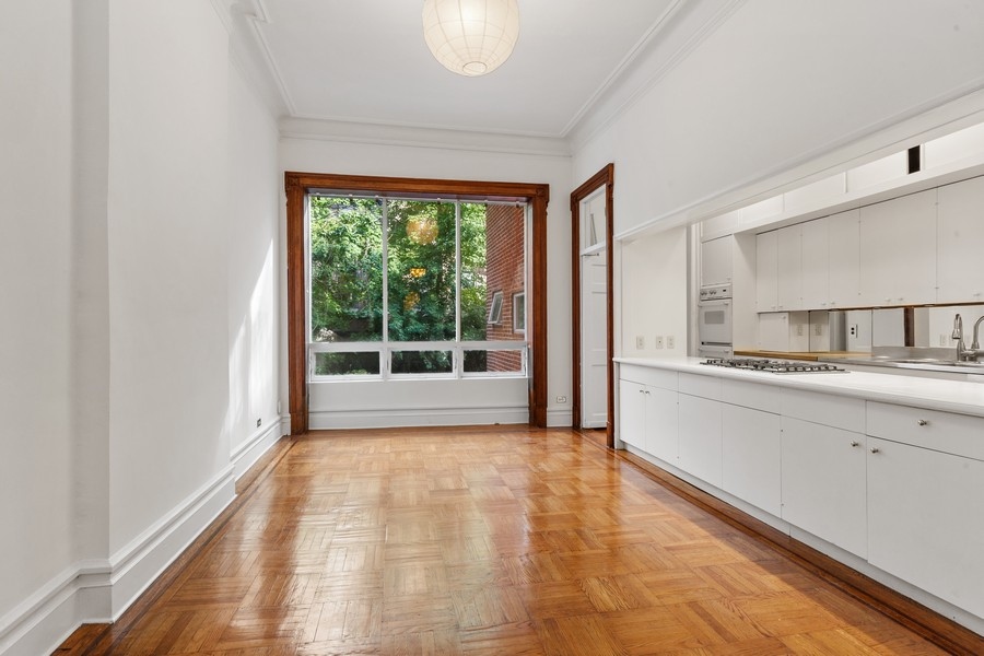 143 West 78th Street Manhattan, NY 10024 - Photo 6 of 17 a view of a kitchen with a sink and a window