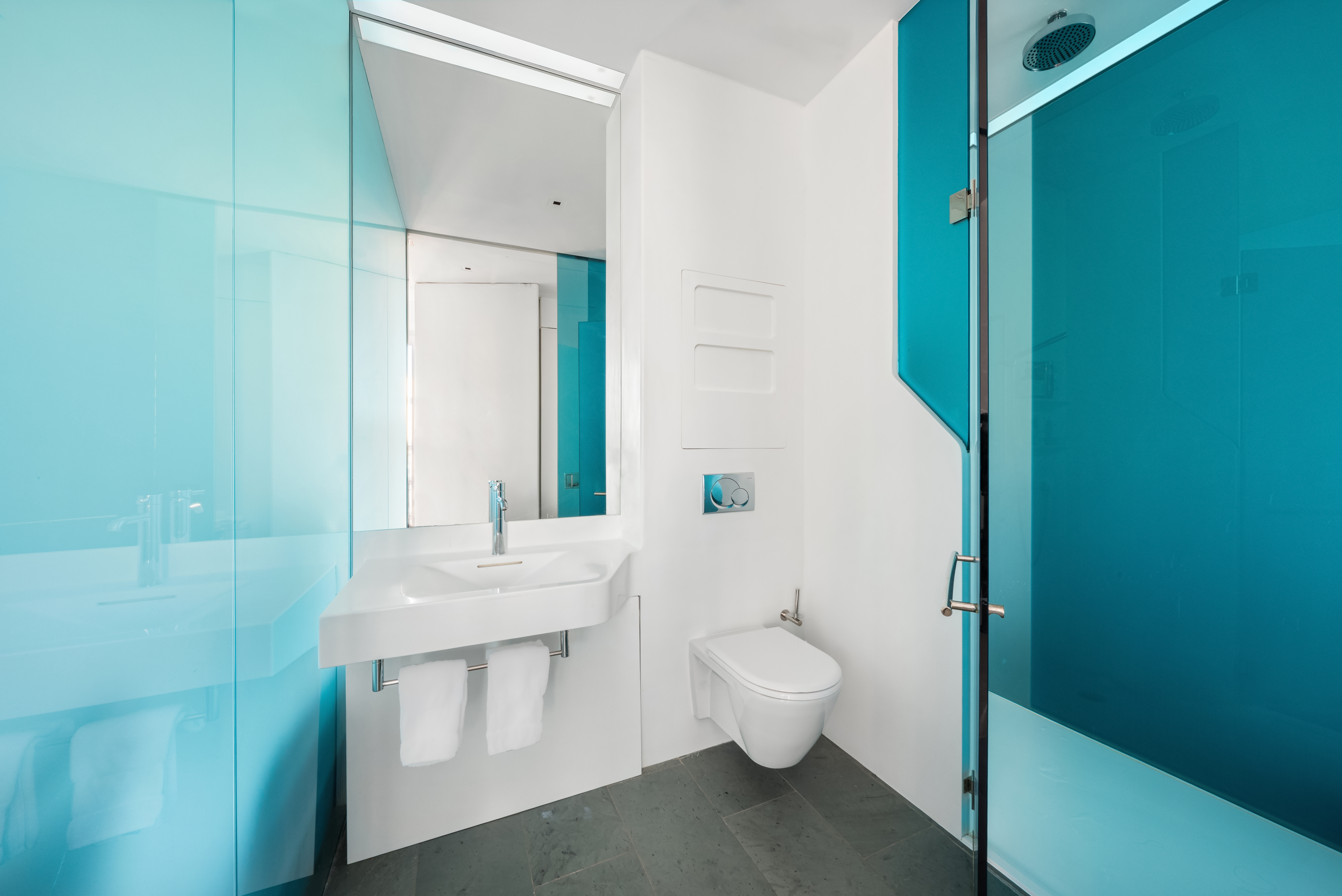 166 Perry Street, Unit 6B Manhattan, NY 10014 - Photo 8 of 14 a bathroom with a toilet sink and mirror