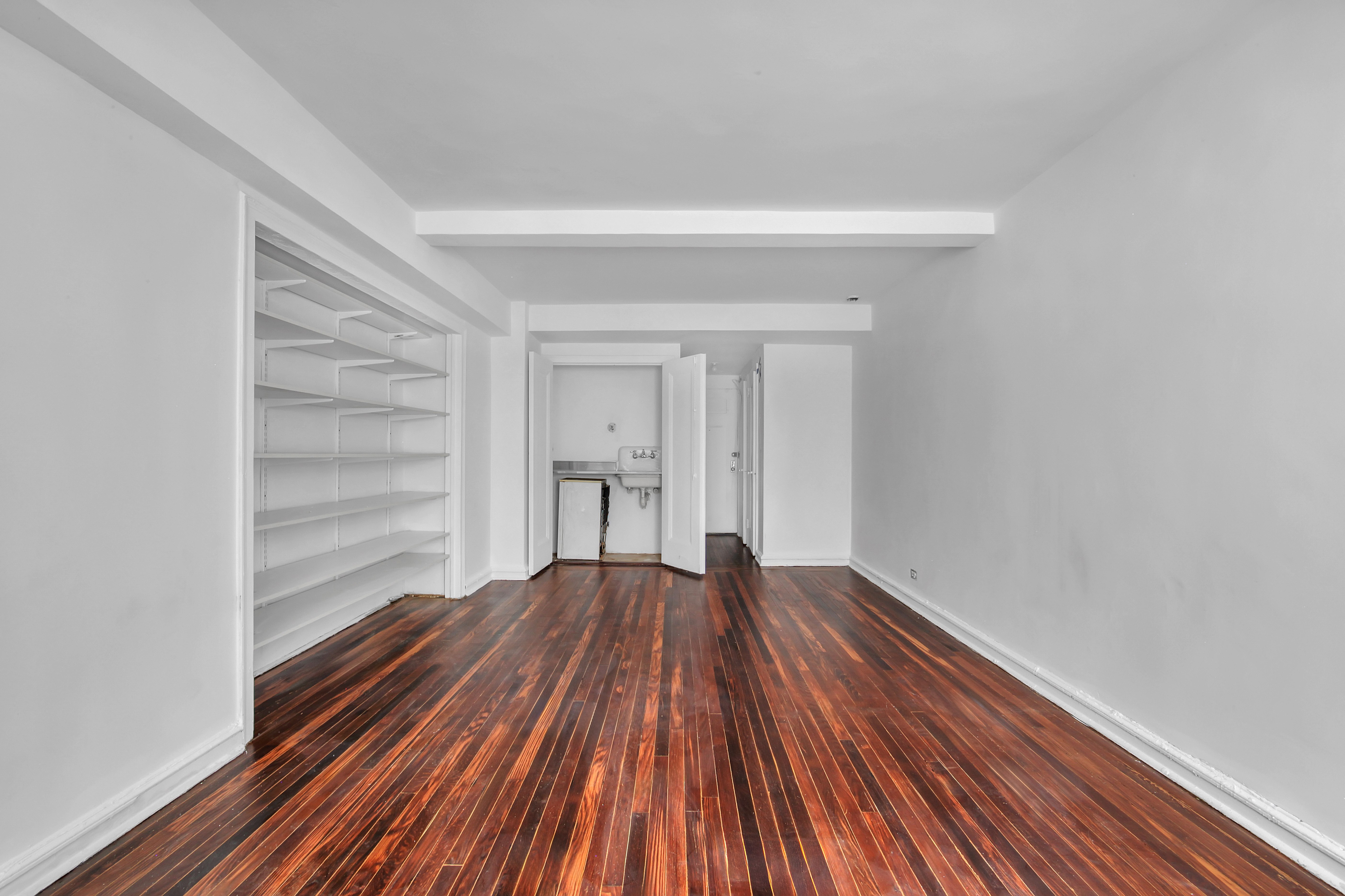 320 East 42nd Street, Unit 516 Manhattan, NY 10017 - Photo 5 of 11 a view of wooden floor in a room