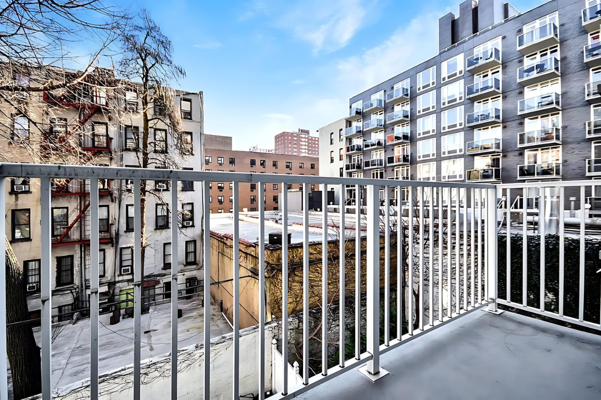 154 Attorney Street, Unit 304 Manhattan, NY 10002 - Photo 5 of 13 a view of a building from a balcony