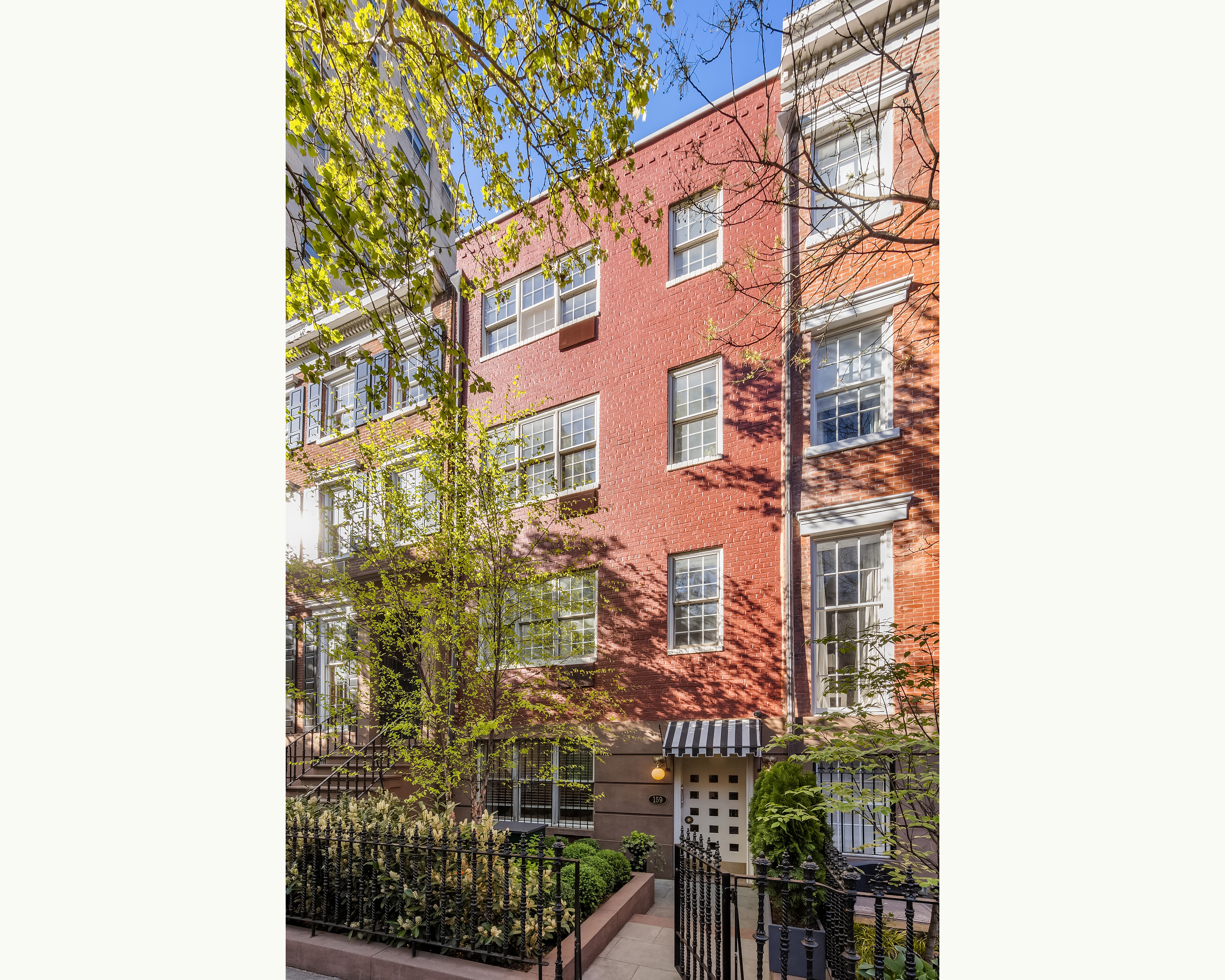159 West 13th Street Manhattan, NY 10011 - Photo 3 of 36 a city street lined with tall buildings