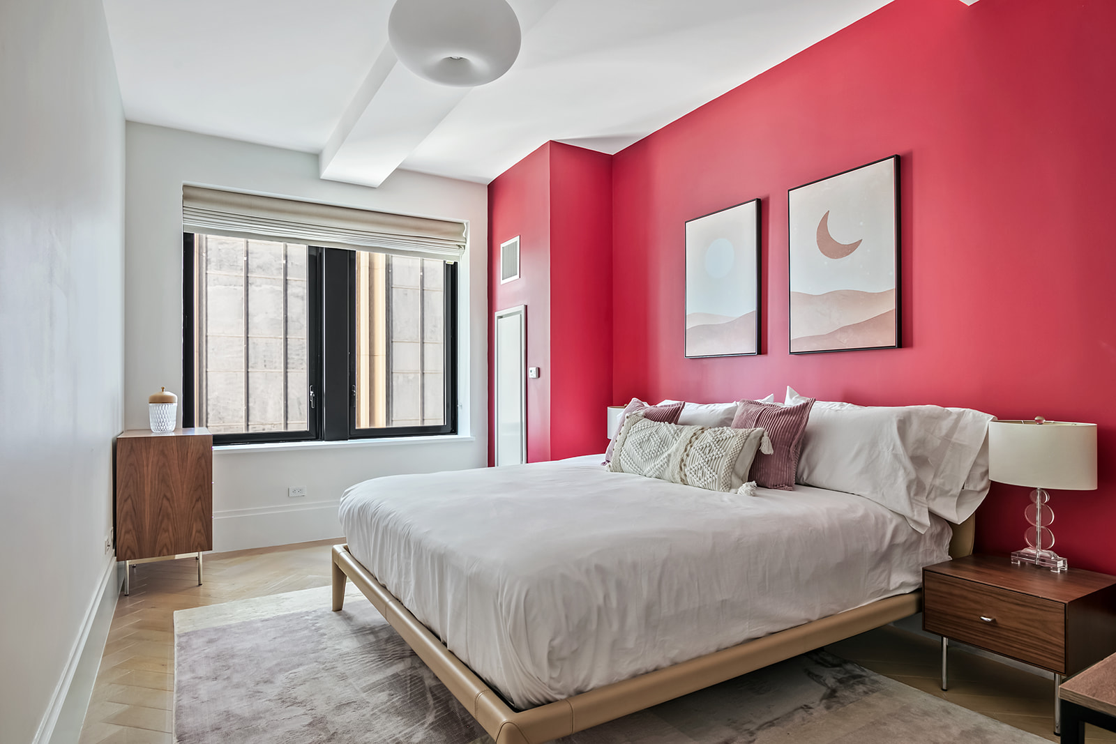 101 Wall Street, Unit 10C Manhattan, NY 10005 - Photo 8 of 15 a bedroom with a bed couch and a window