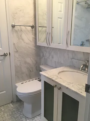 30 West 63rd Street, Unit 28L Manhattan, NY 10023 - Photo 8 of 11 a bathroom with a sink and a mirror