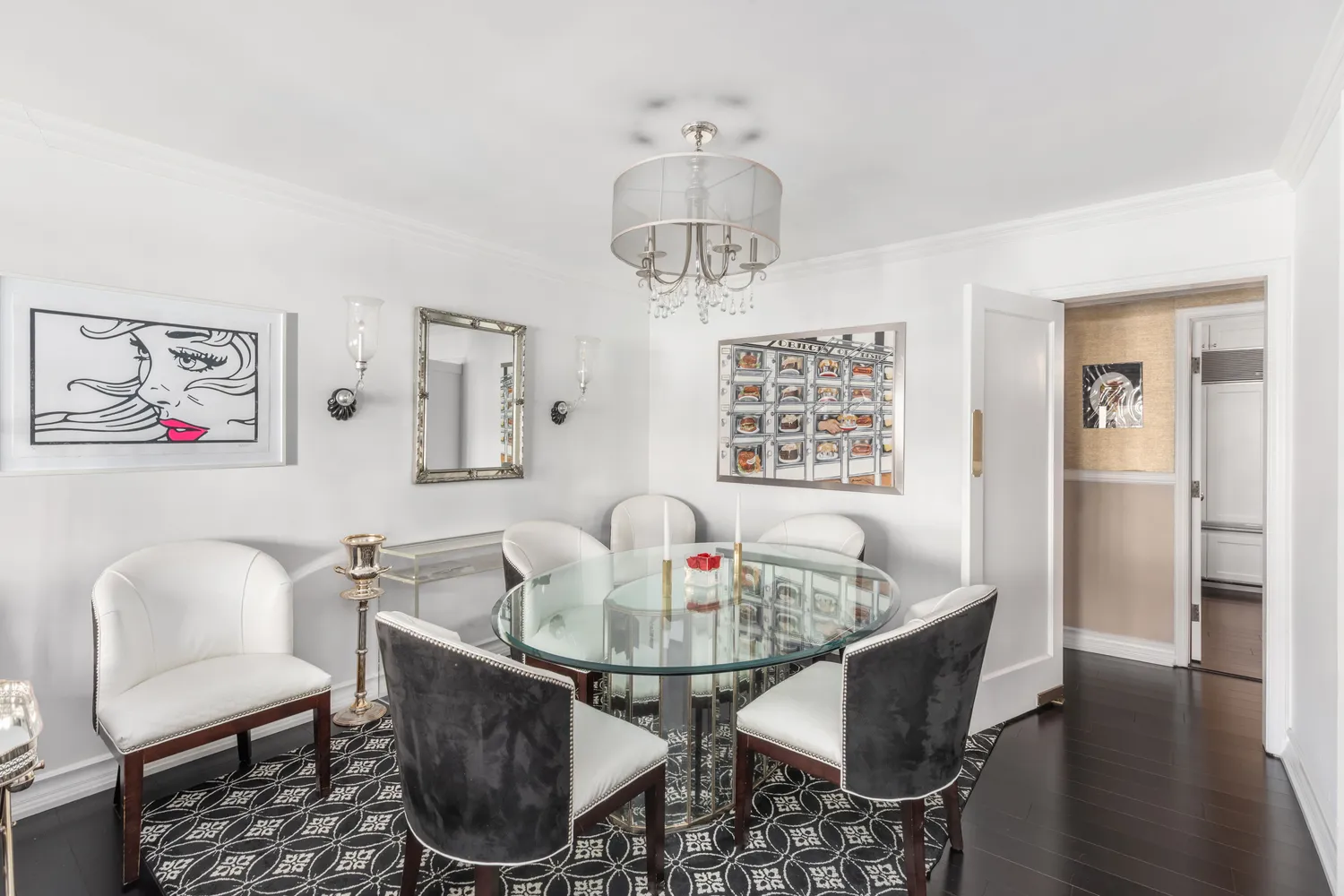 a dining room with furniture a window and wooden floor