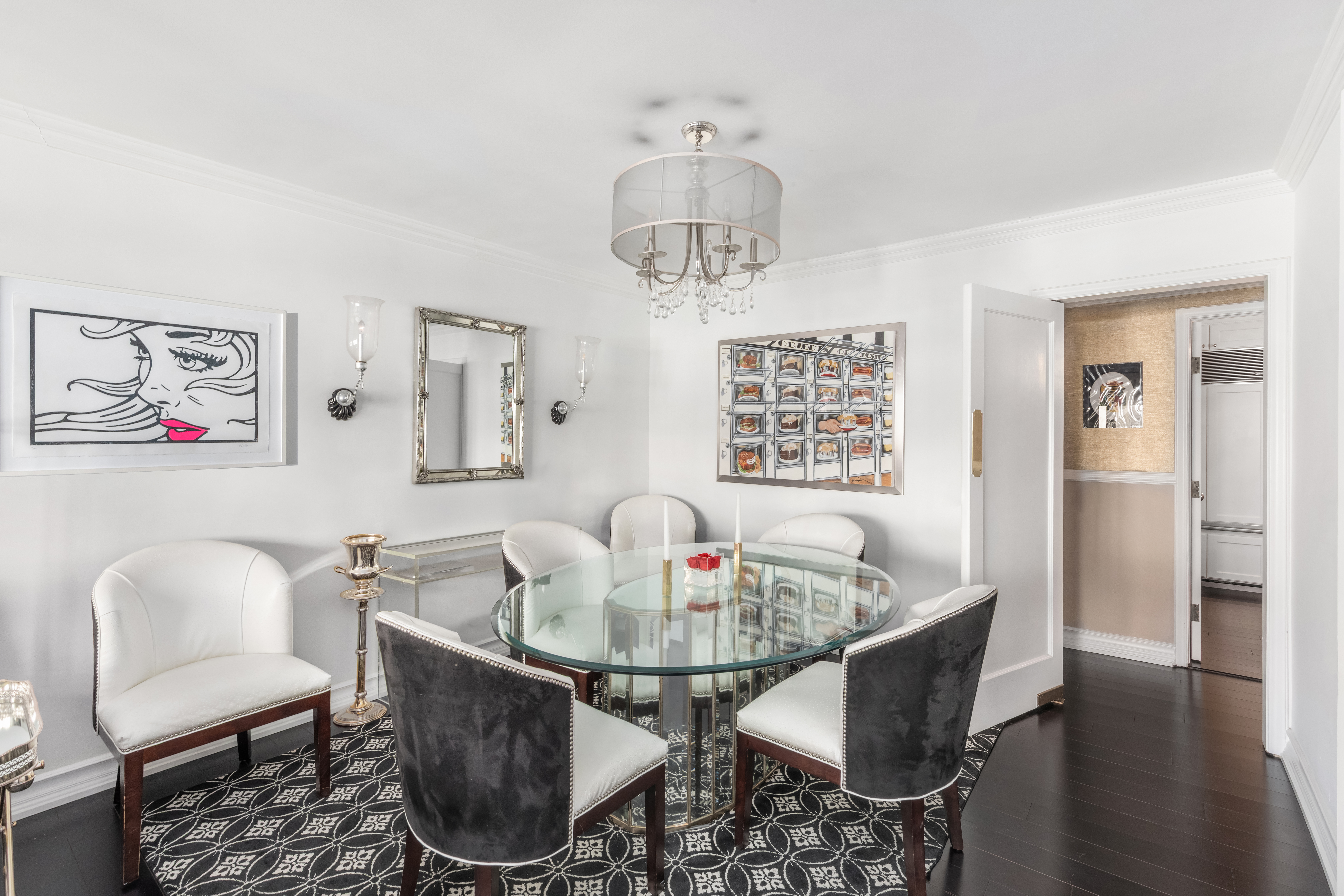 27 East 65th Street, Unit 10BC Manhattan, NY 10065 - Photo 4 of 16 a dining room with furniture a window and wooden floor