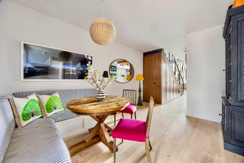a bedroom with furniture and a flat screen tv
