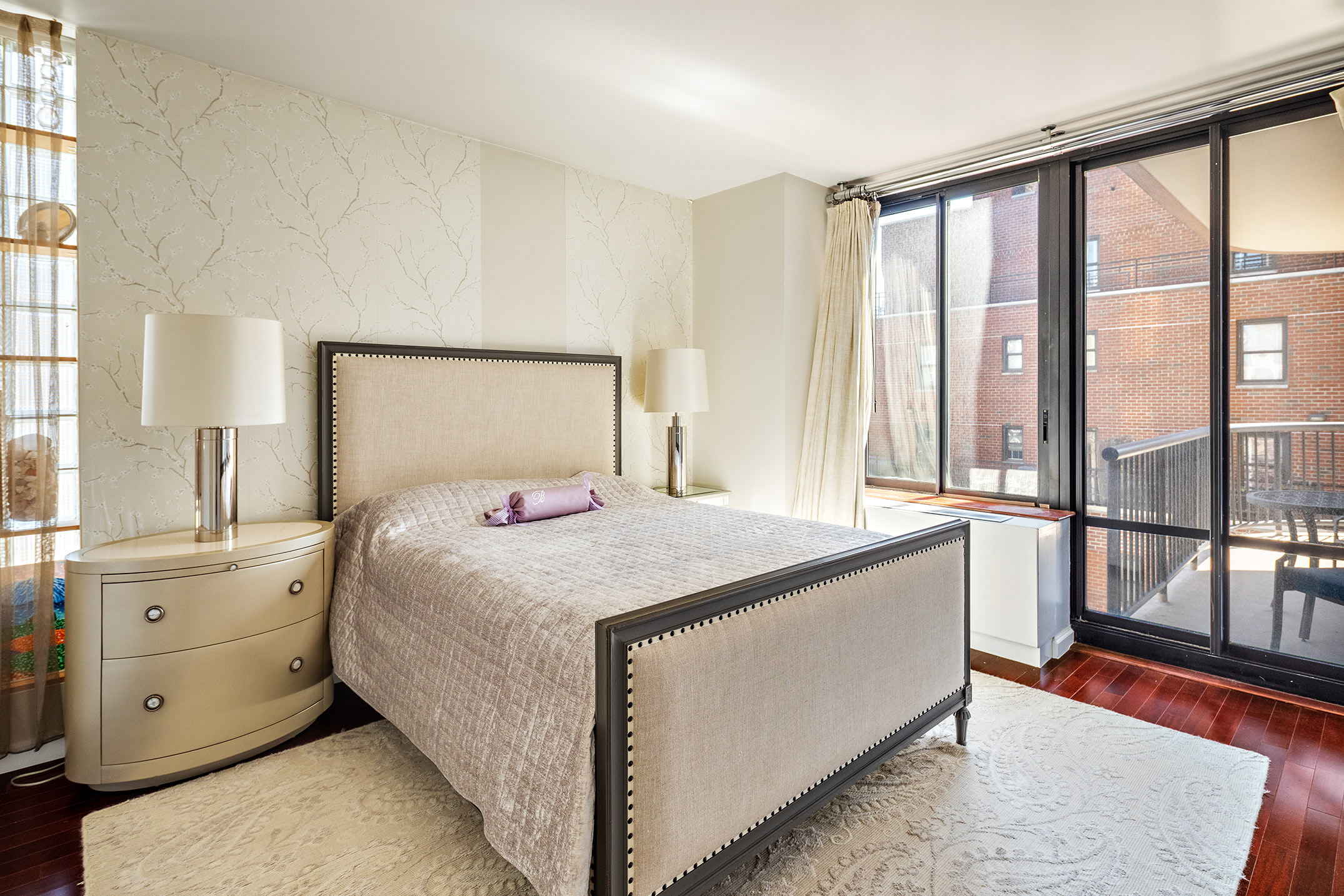 304 East 65th Street, Unit 10D Manhattan, NY 10065 - Photo 4 of 14 a bedroom with a large bed and a large window