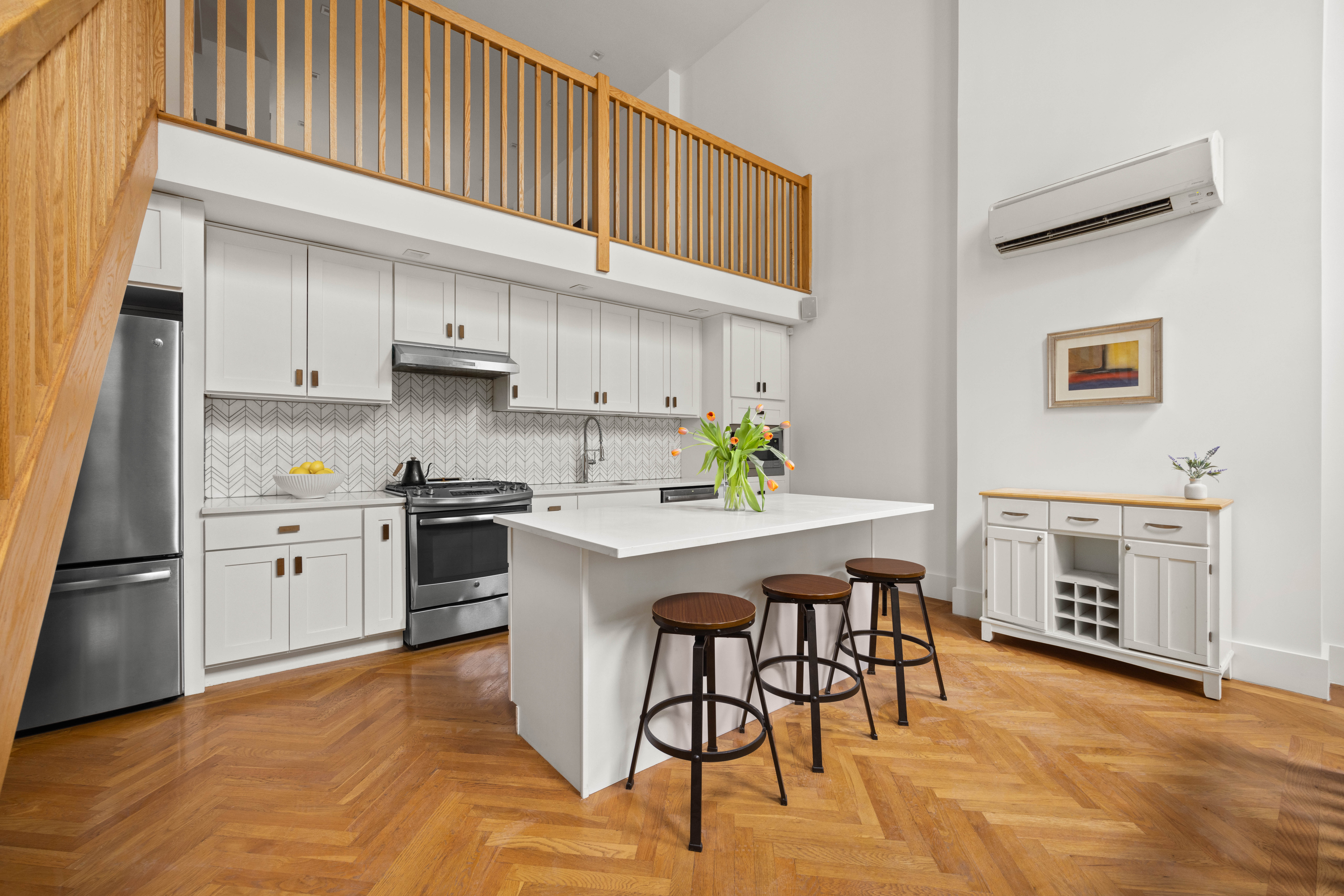 750 Lincoln Place Brooklyn, NY 11216 - Photo 6 of 24 a kitchen with a stove a sink white cabinets and stainless steel appliances