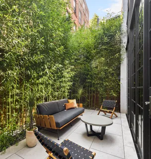 a outdoor living space with furniture and a potted plant