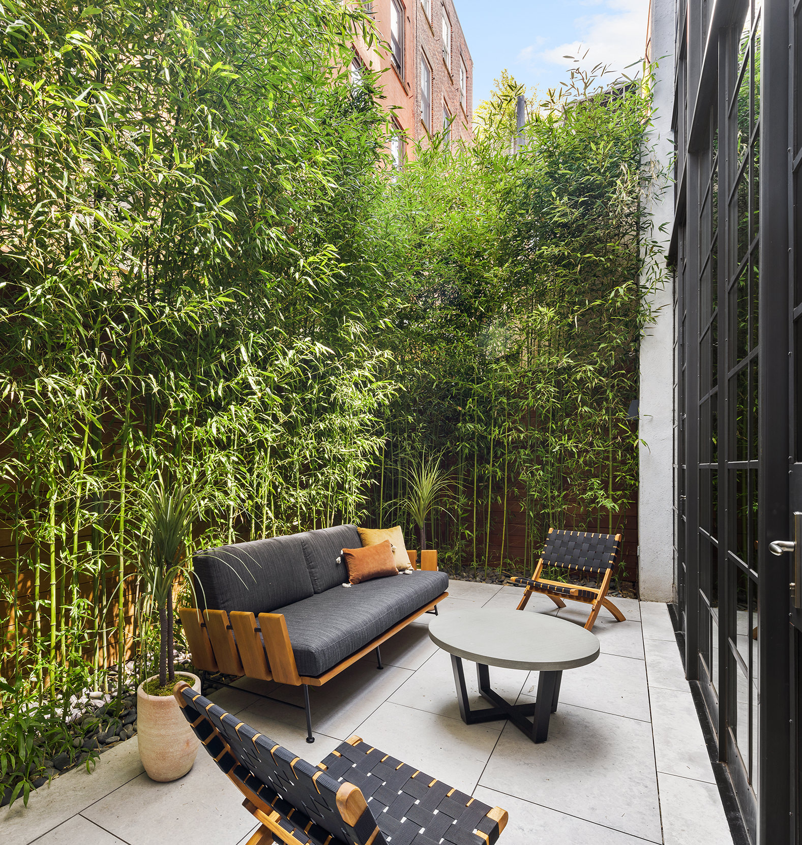 7 Harrison Street, Unit ATELIER Manhattan, NY 10013 - Photo 2 of 24 a outdoor living space with furniture and a potted plant