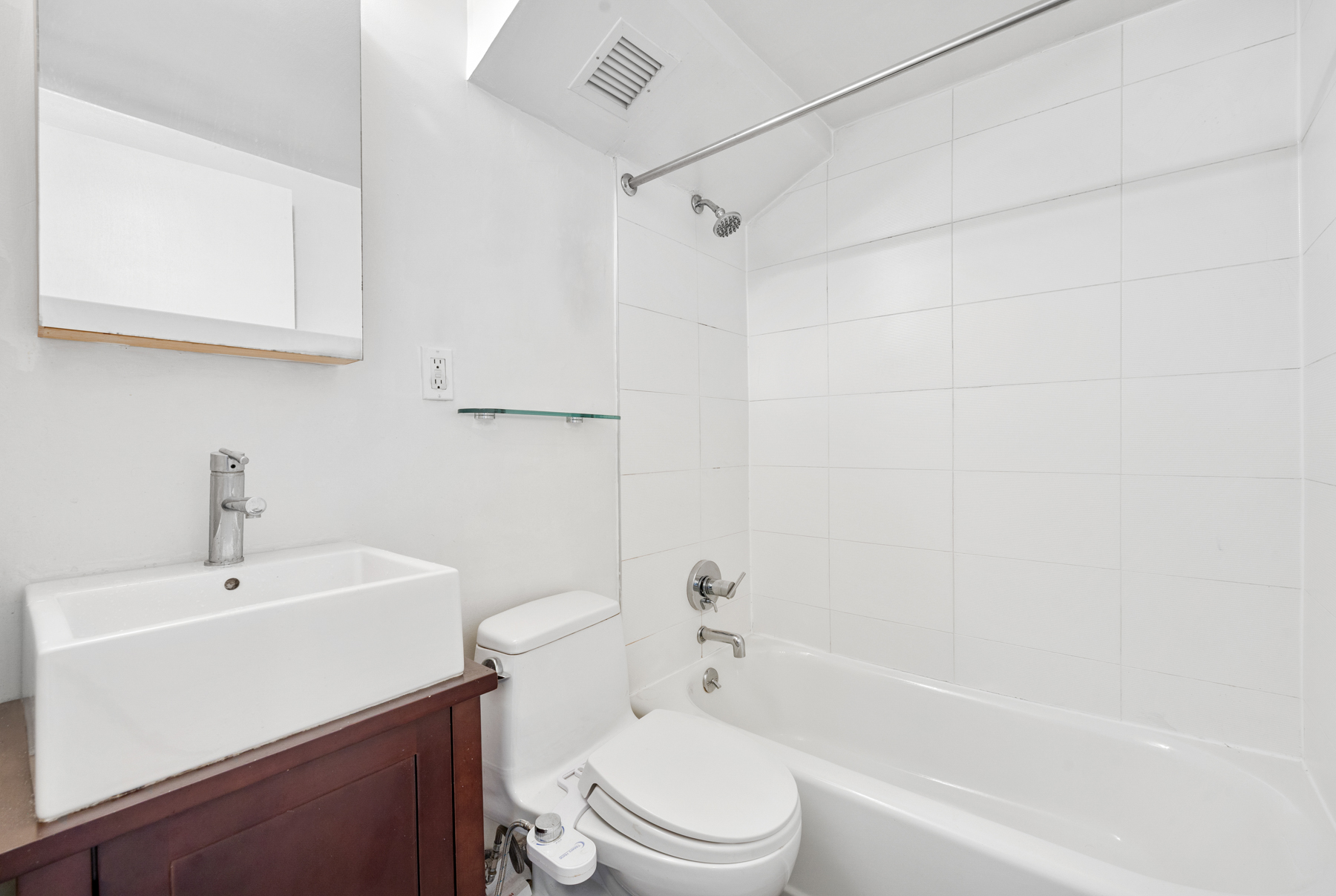 184 Thompson Street, Unit 4U Manhattan, NY 10012 - Photo 9 of 9 a bathroom with a sink a toilet and a bathtub