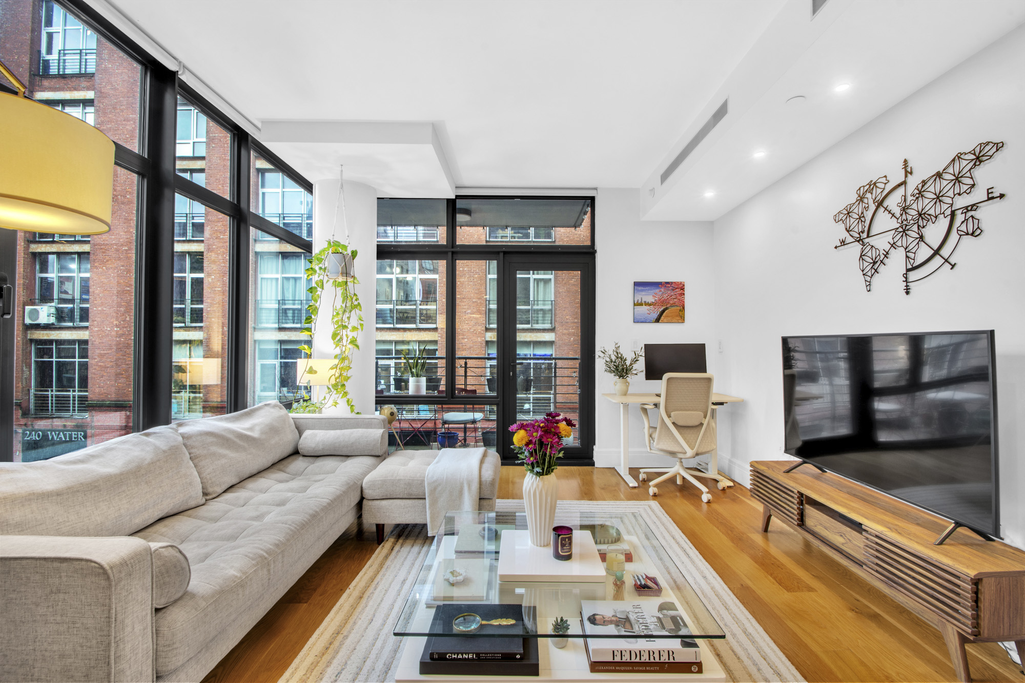 47 Bridge Street, Unit 3D Brooklyn, NY 11201 - Photo 3 of 27 a living room with furniture flat screen tv and a large window