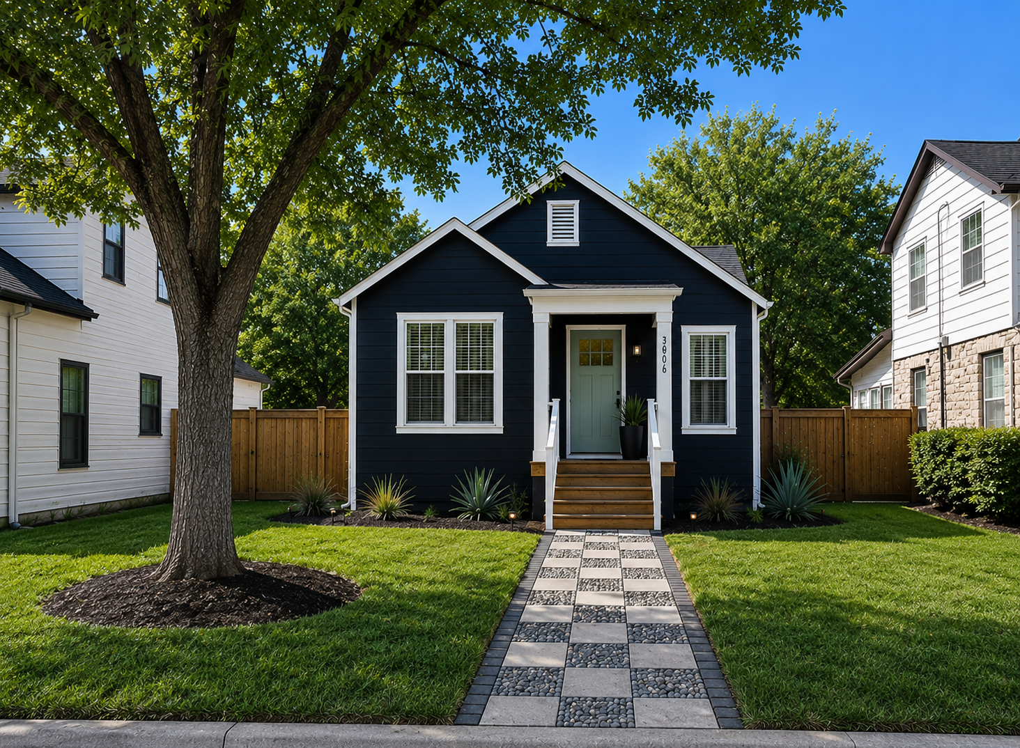 3906 Willbert Road Austin, TX 78751 - Photo 1 of 25 a front view of a house with garden