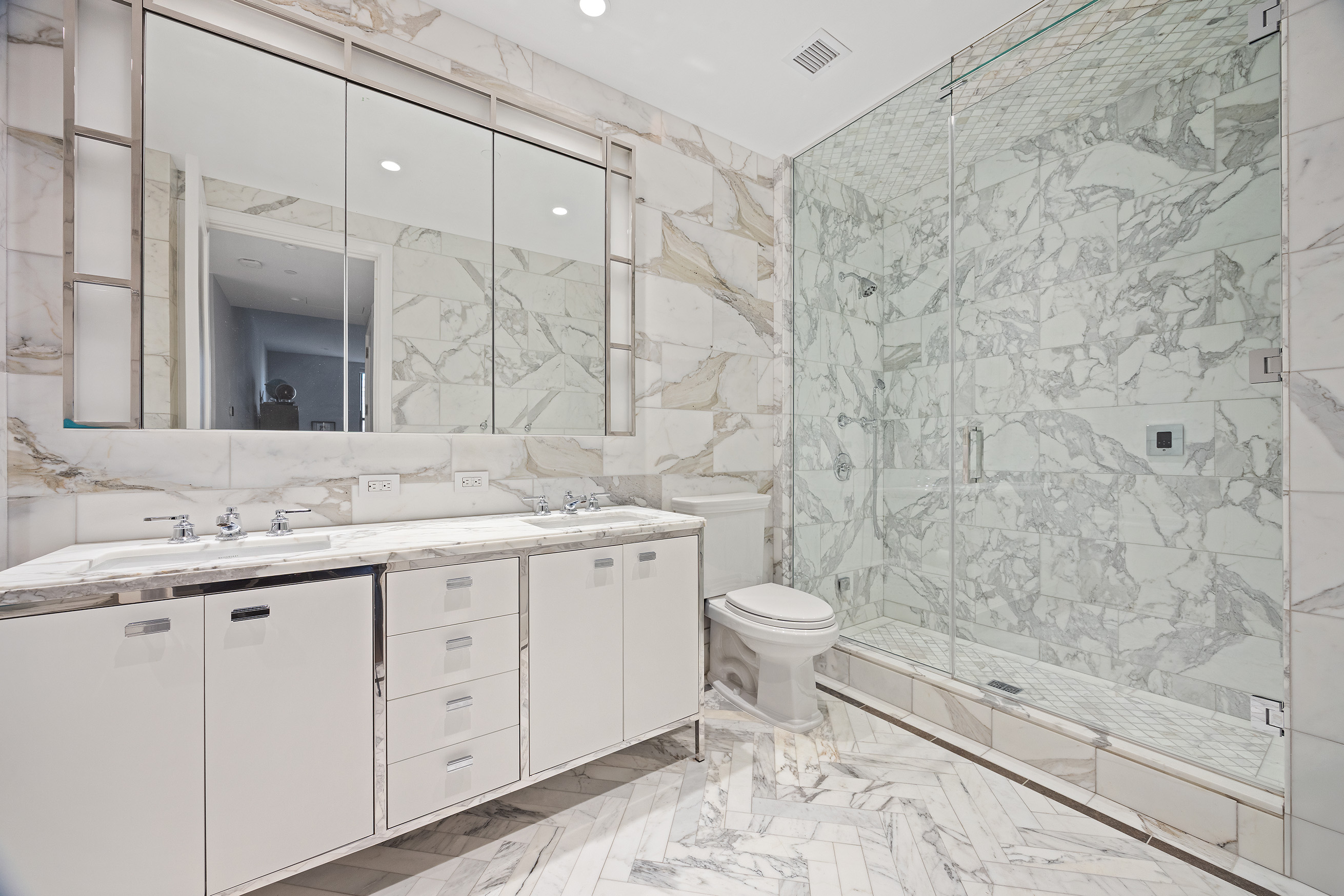 100 Barclay Street, Unit 21AD Manhattan, NY 10007 - Photo 19 of 37 a bathroom with a granite countertop sink toilet and shower