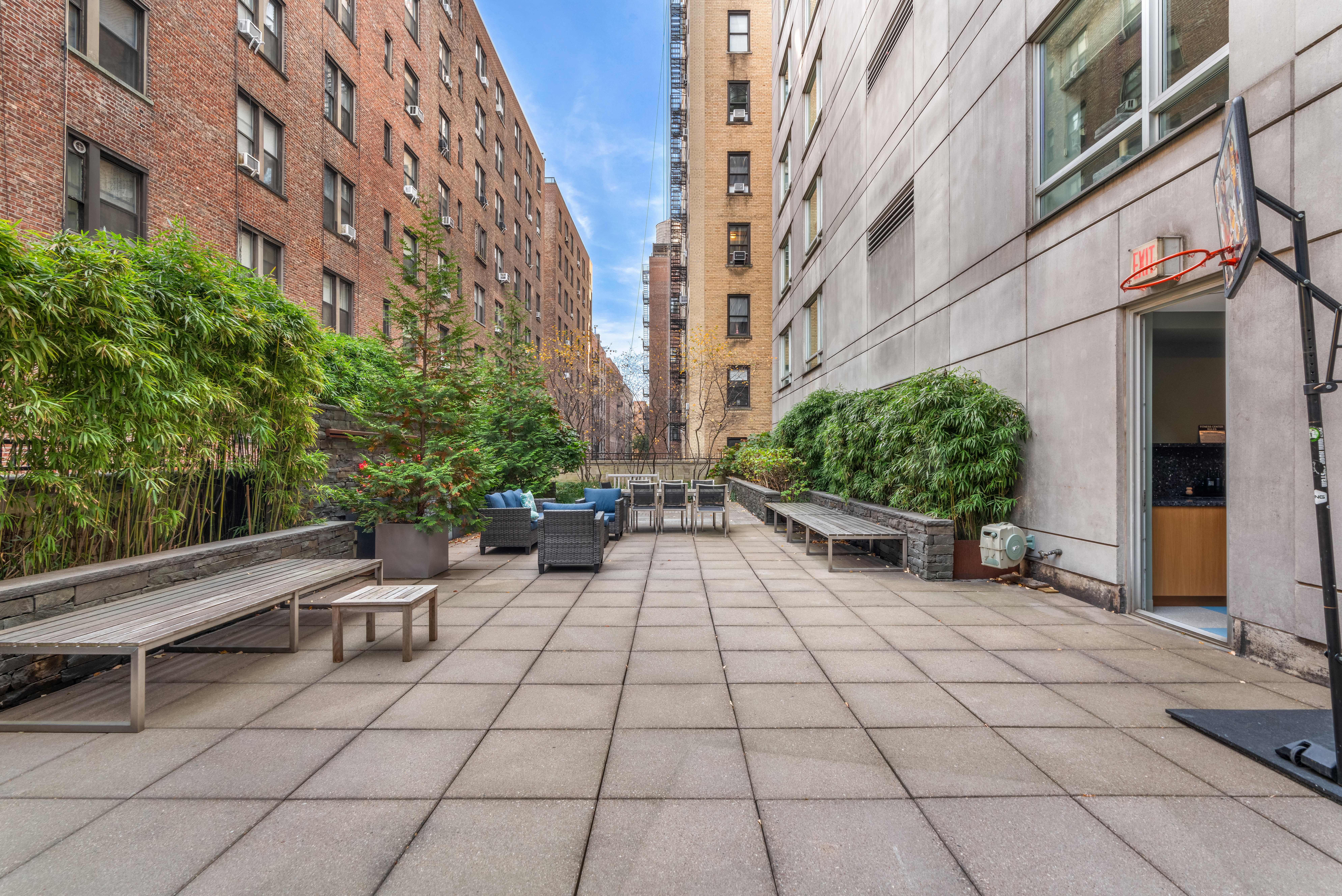 545 West 110th Street, Unit 9D Manhattan, NY 10025 - Photo 15 of 17 a view of a patio with a table and chairs and potted plants
