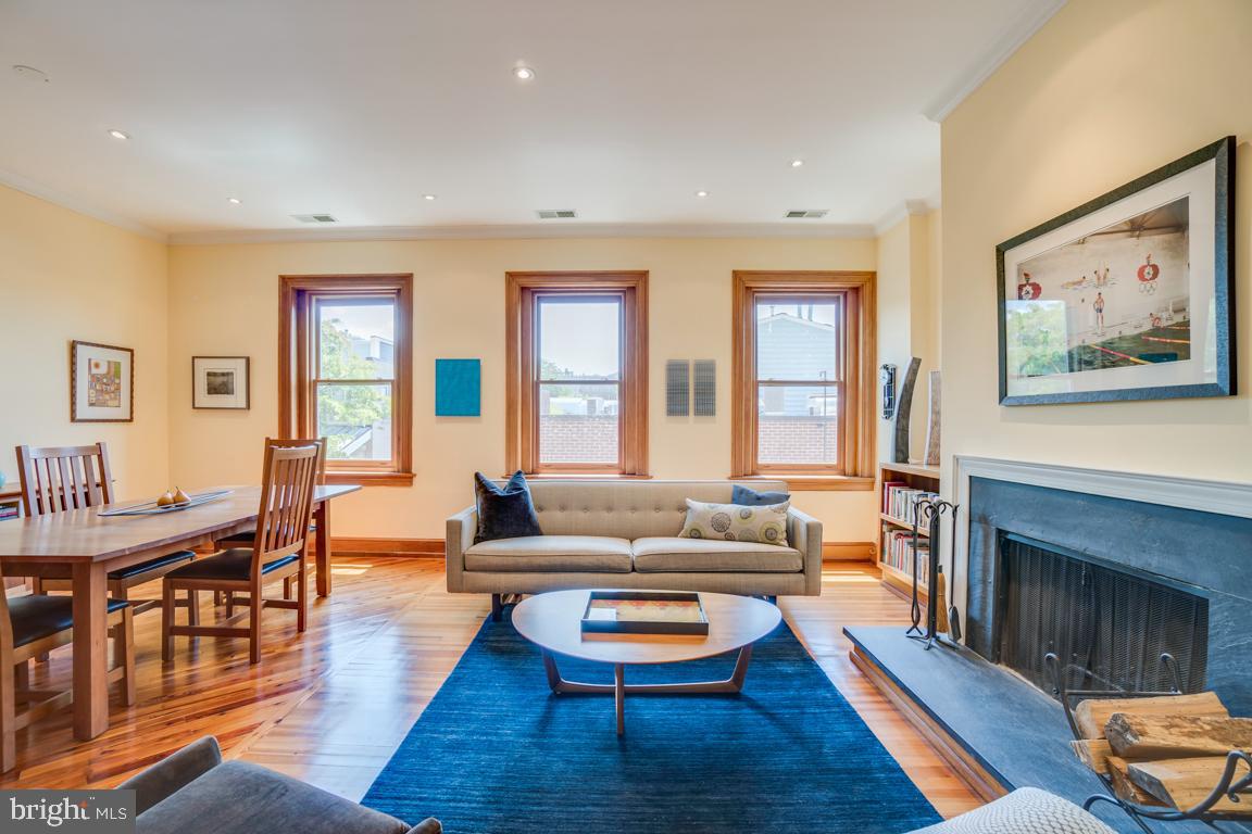 2415 20th Street Northwest, Unit 38 Washington, DC 20009 - Photo 5 of 30 a living room with furniture and a fireplace