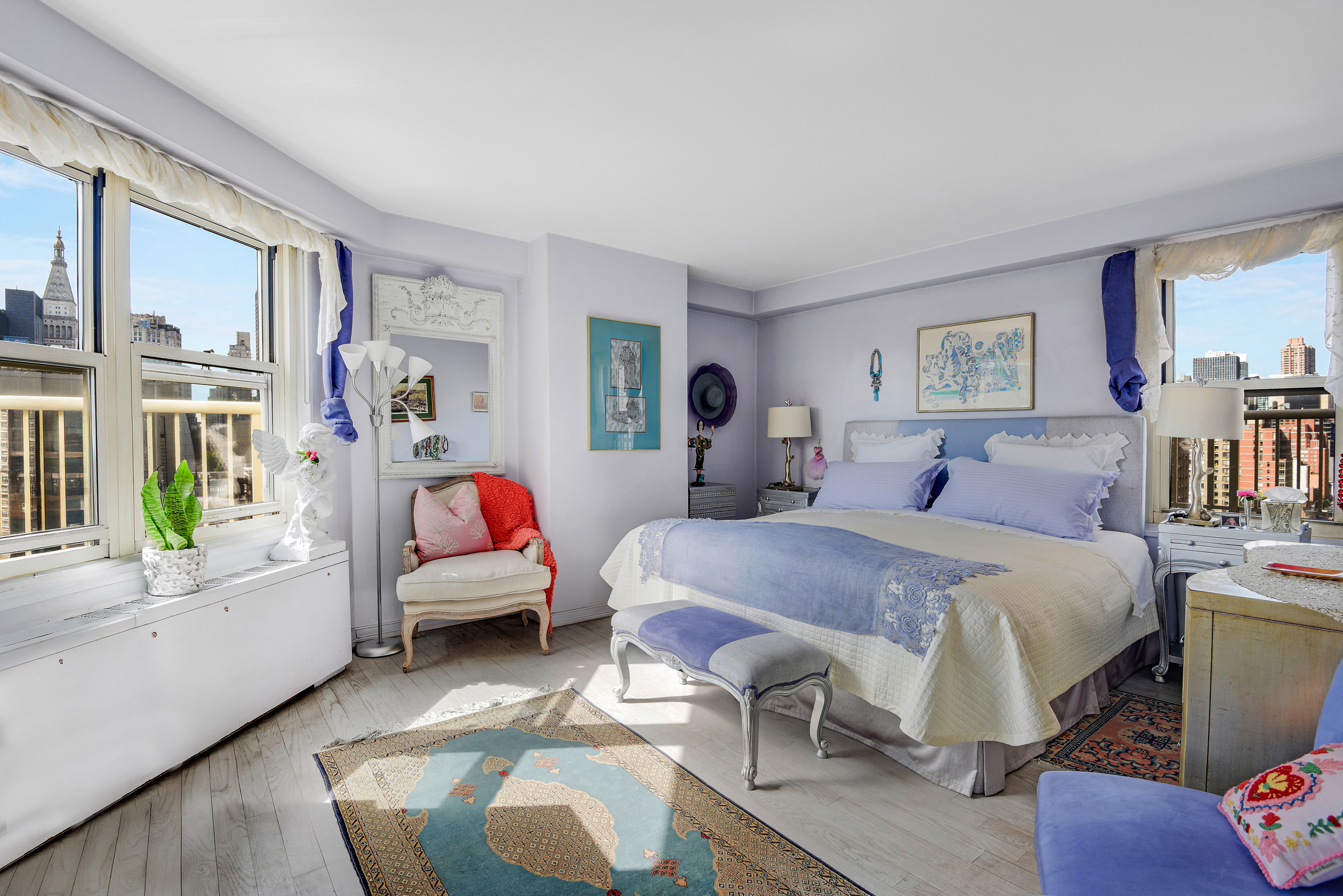 305 East 24th Street, Unit 18C Manhattan, NY 10010 - Photo 9 of 13 a bedroom with a bed and wooden floor