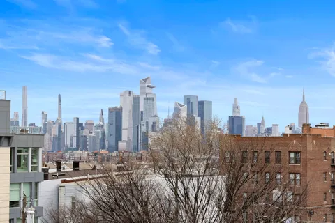 a view of a city with tall buildings