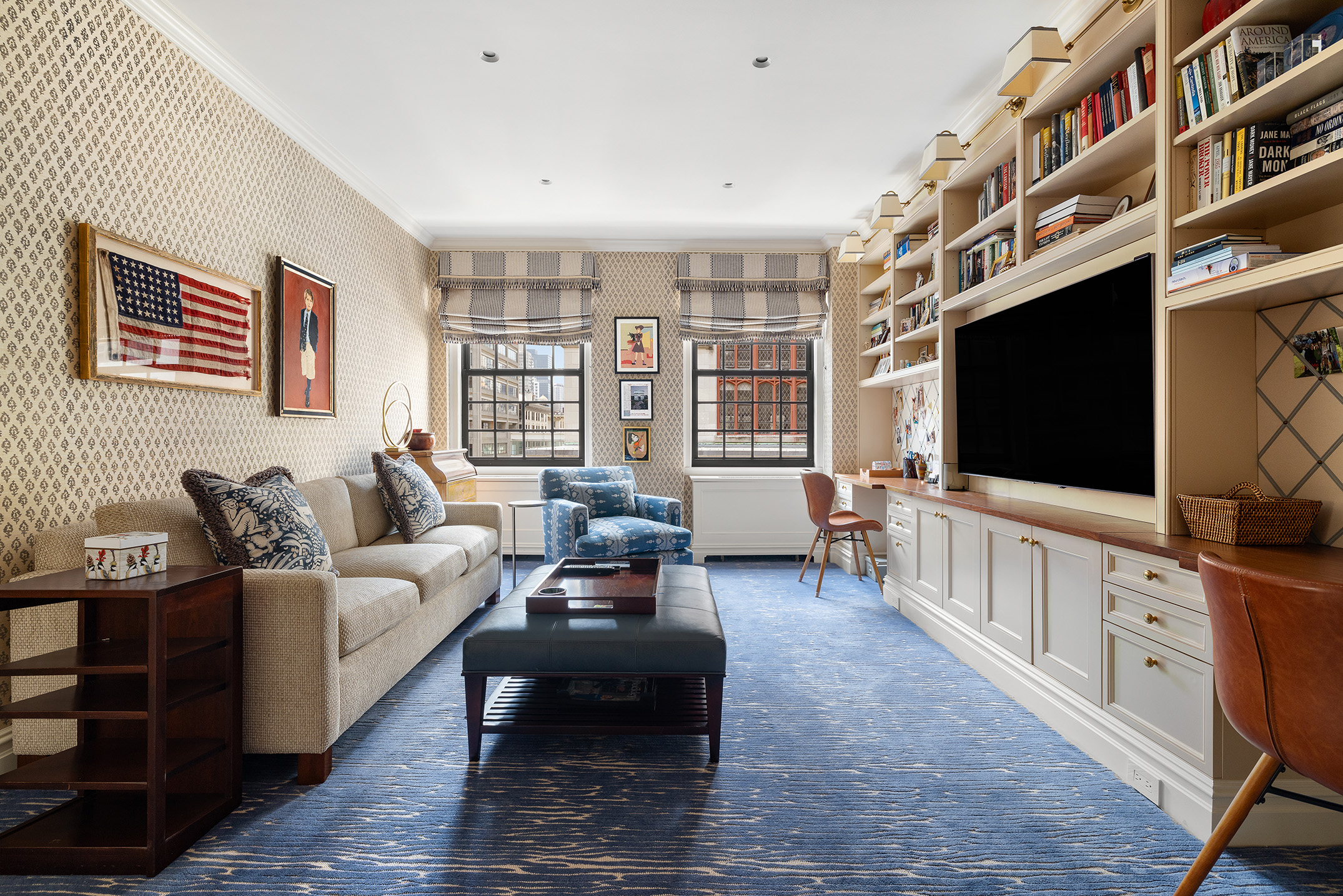 129 East 69th Street, Unit 8/9A Manhattan, NY 10021 - Photo 9 of 16 a living room with furniture and a flat screen tv