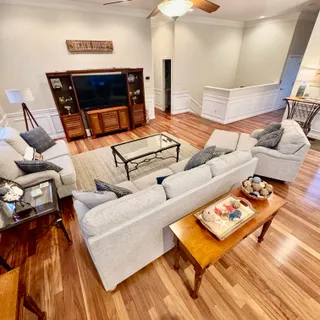 a living room with furniture and a rug