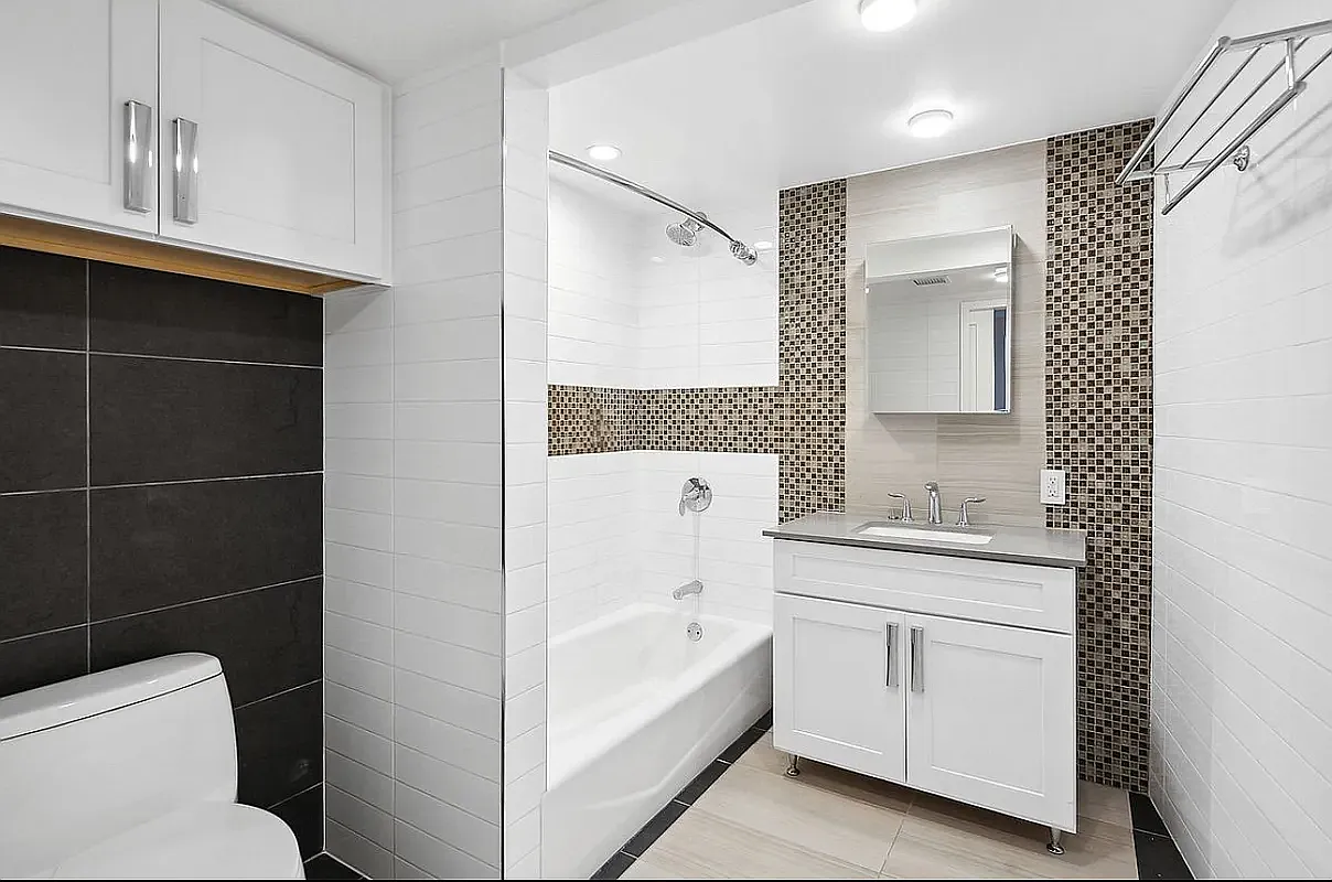 25 Lexington Avenue, Unit 202 Brooklyn, NY 11238 - Photo 4 of 7 a bathroom with a sink a toilet and shower