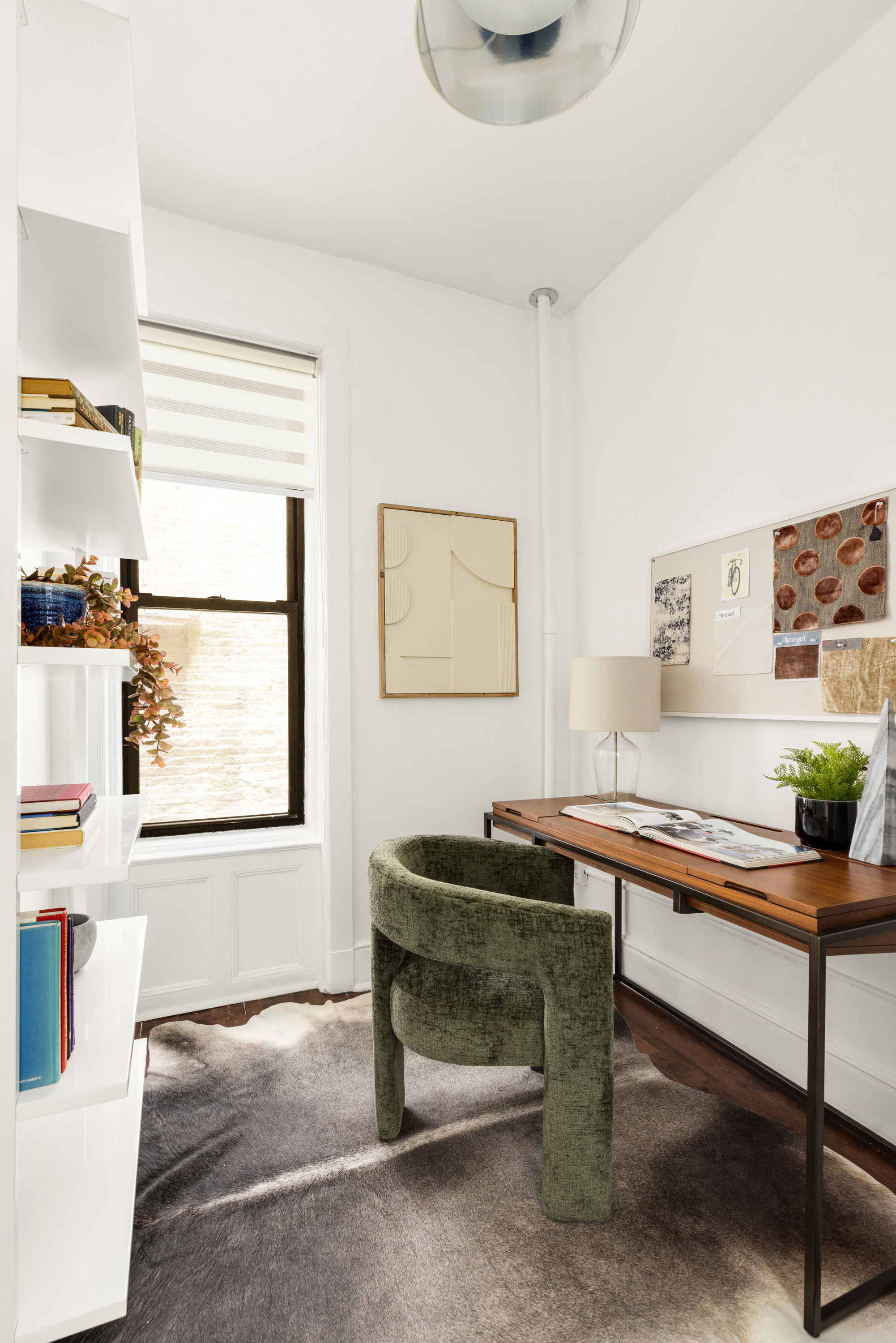 126 East 12th Street, Unit 2C Manhattan, NY 10003 - Photo 6 of 10 a view of a workspace with furniture and a window