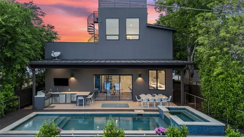 a front view of house with yard outdoor seating and green space