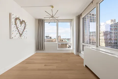 a view of a room with a large window