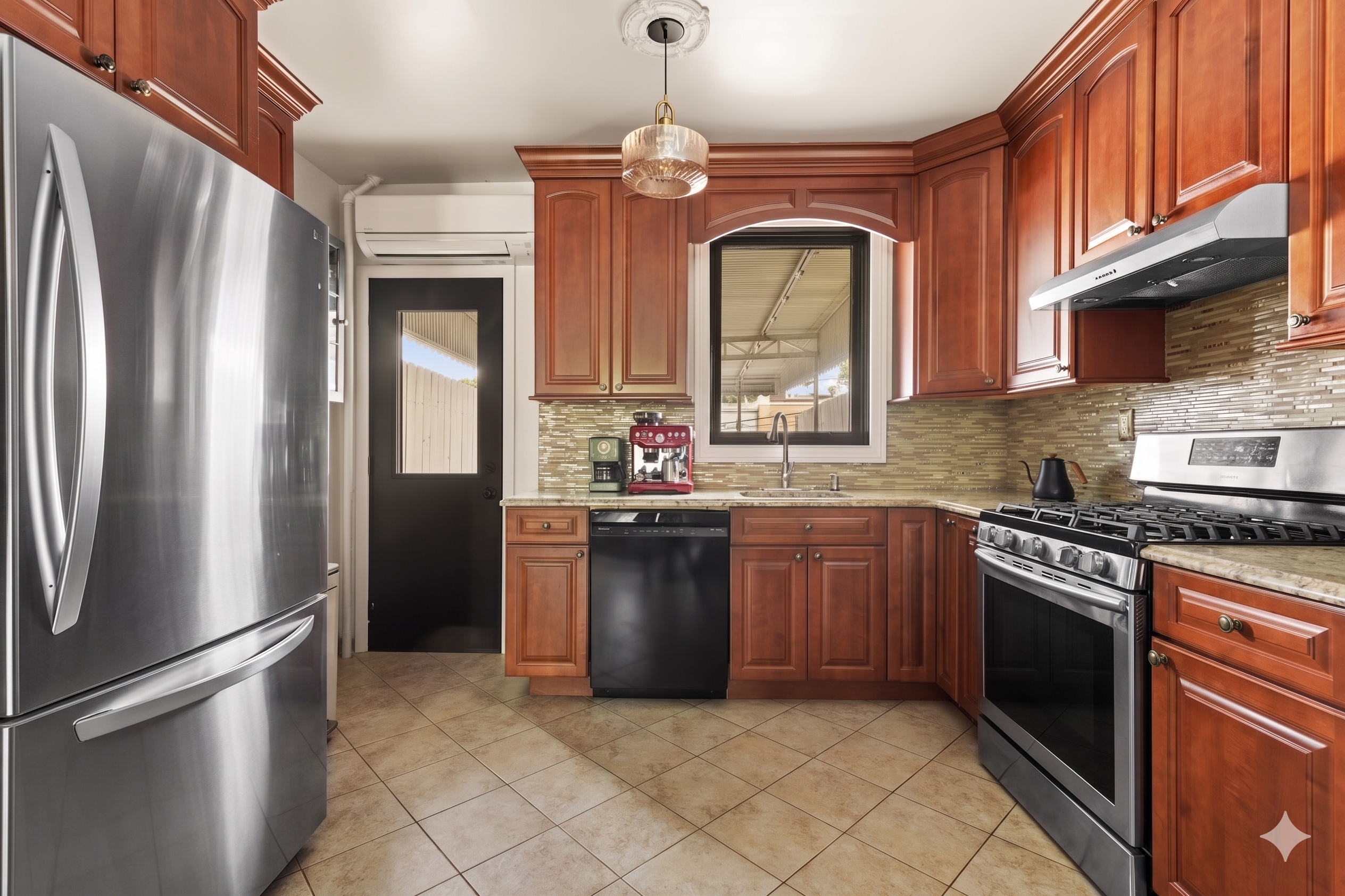570 19th Street Brooklyn, NY 11218 - Photo 3 of 13 a kitchen with stainless steel appliances granite countertop a refrigerator a stove a sink and a microwave